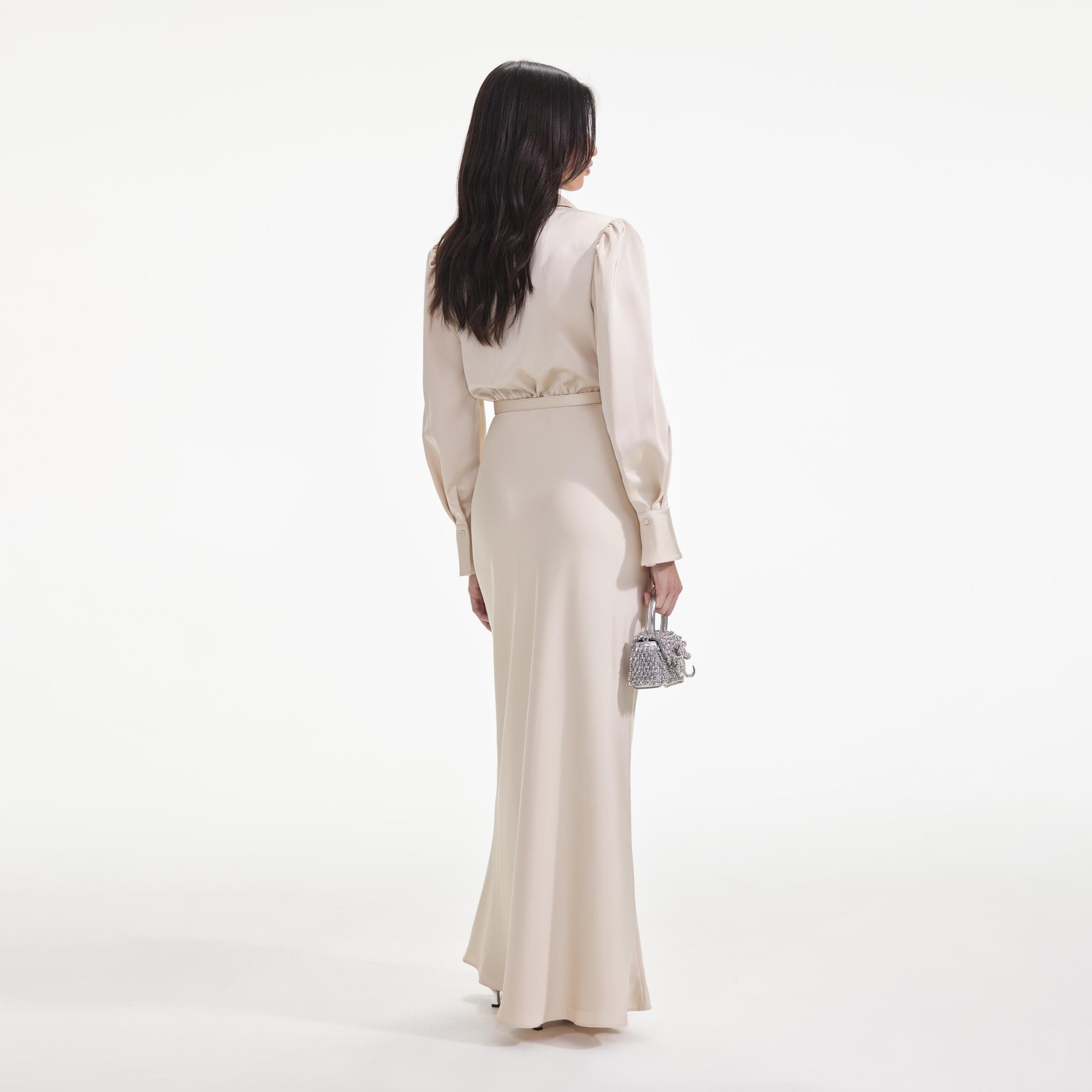 Back view of a woman wearing the Cream Satin Embellished Bib Maxi Dress