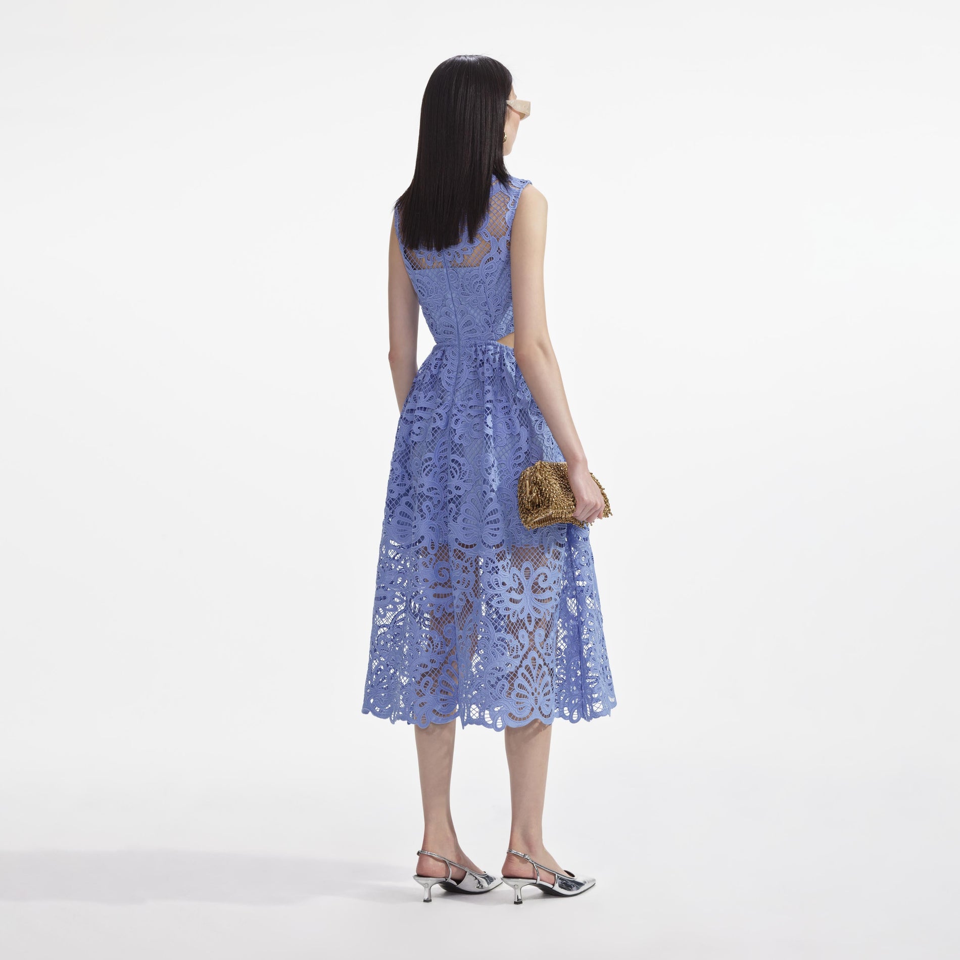 Back view of a woman wearing the Blue Lace Cut Out Midi Dress