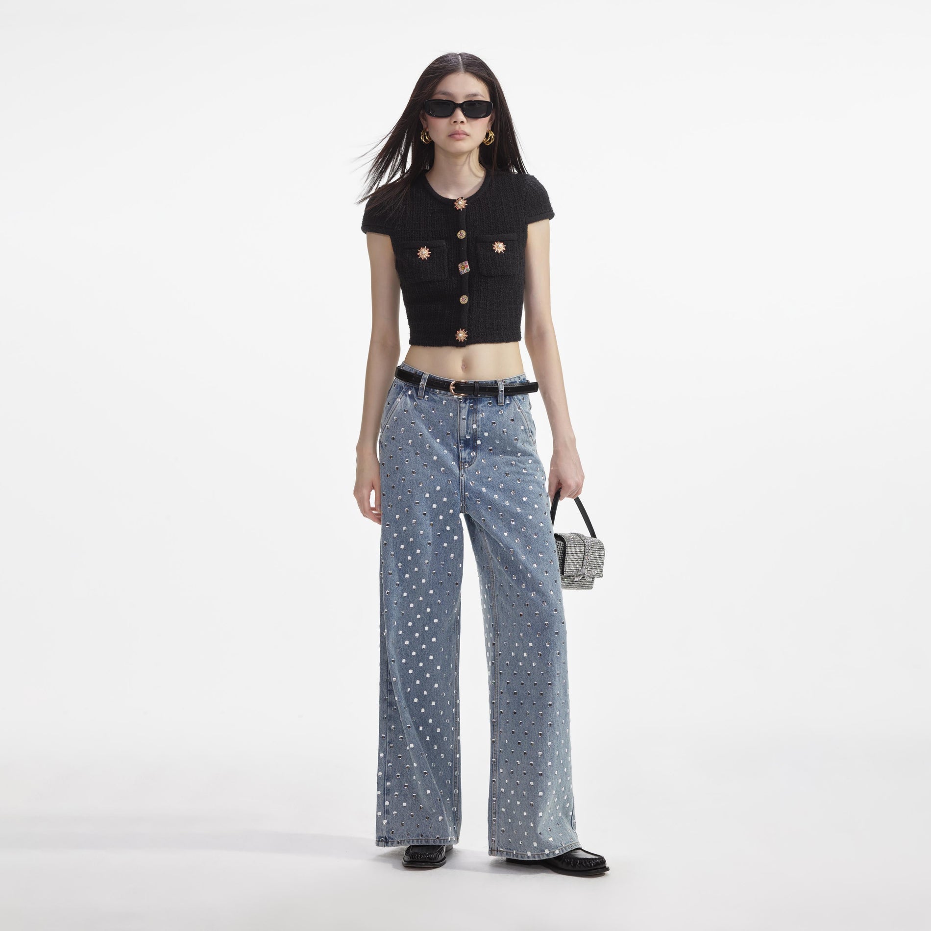 Front view of a woman wearing the Black Jewel Button Knit Top