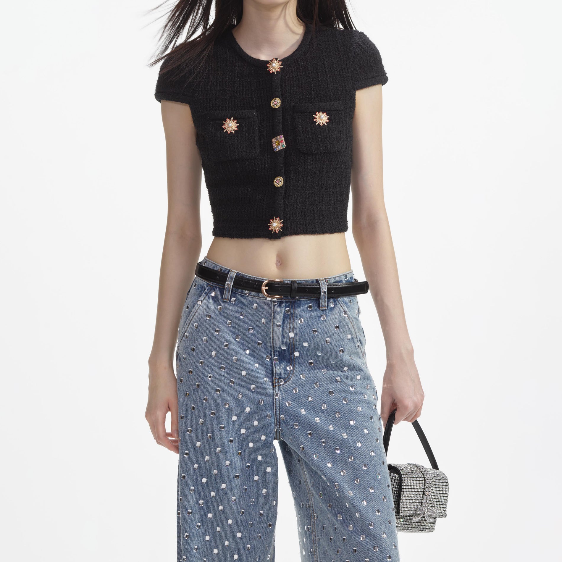 A close up of a woman wearing the Black Jewel Button Knit Top