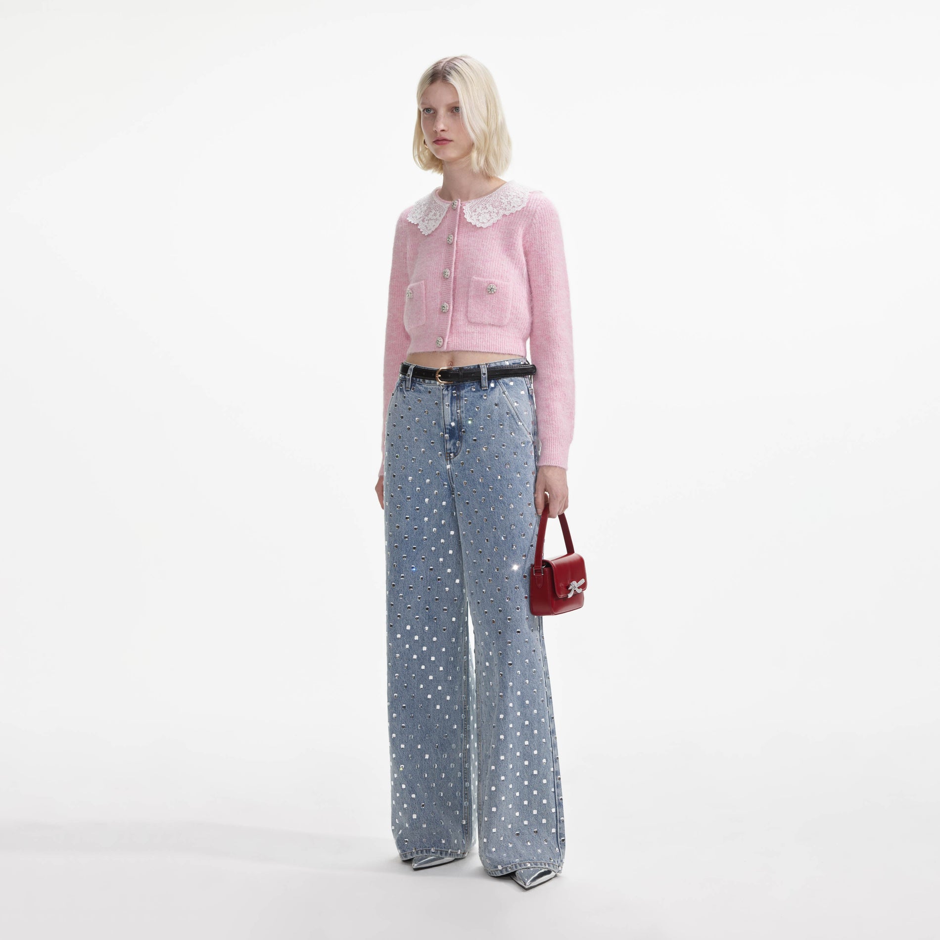 Side view of a woman wearing the Pink Fluffy Rib Knit Cardigan