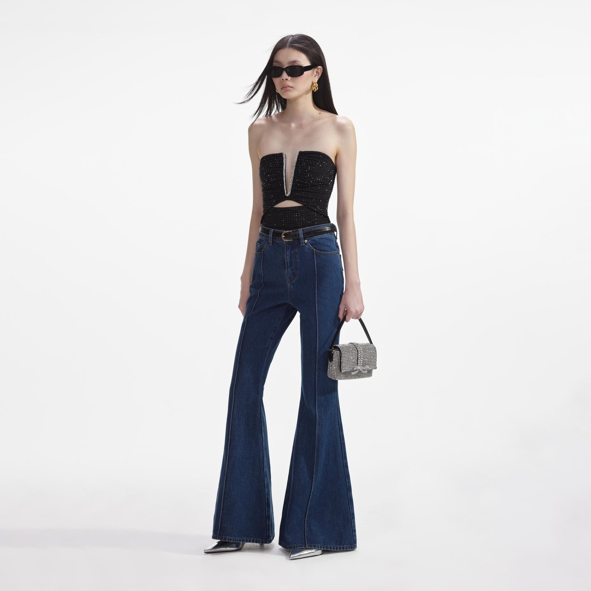 Side view of a woman wearing the Denim Kick Flare Jeans