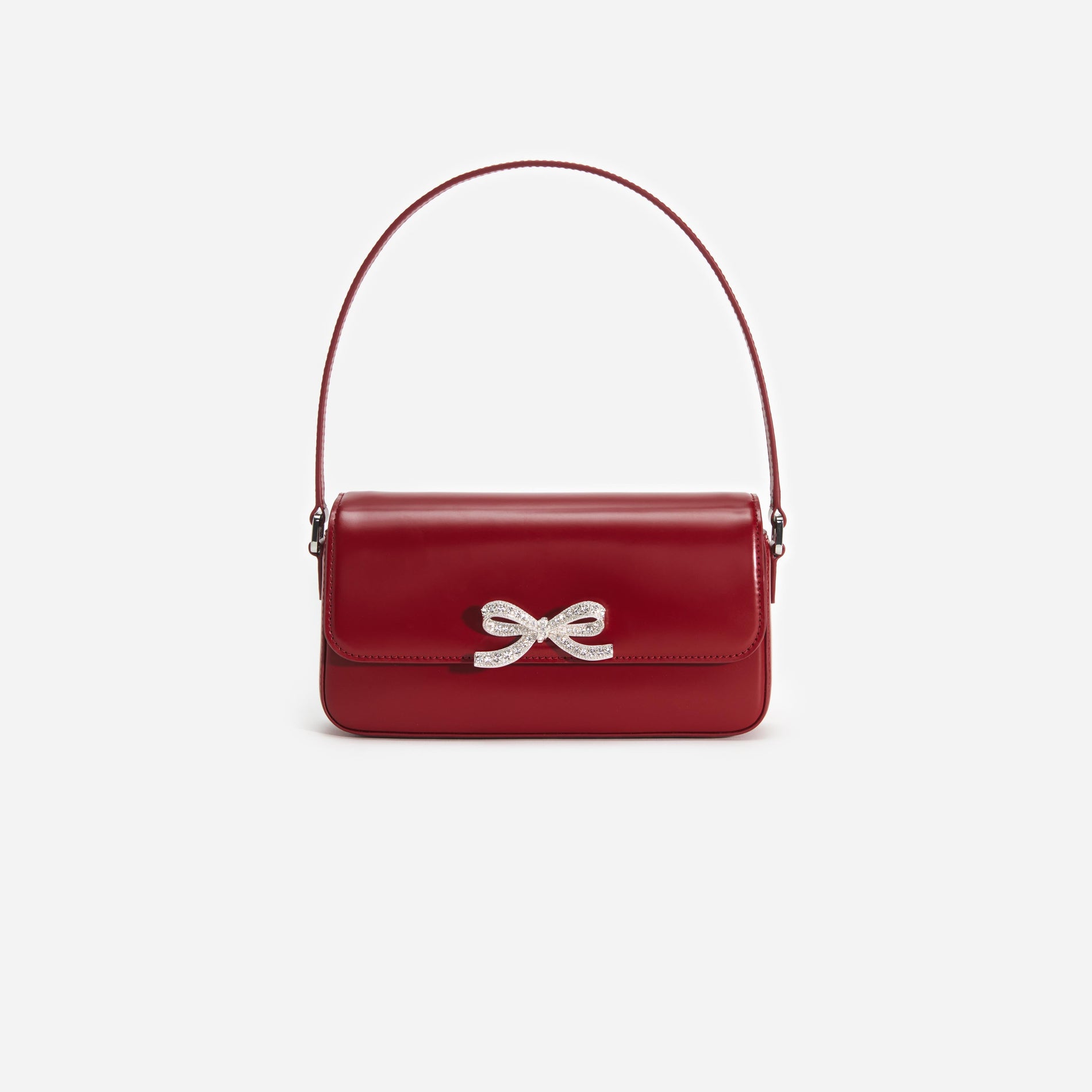 Front view of a woman wearing the Burgundy Leather Baguette Bag