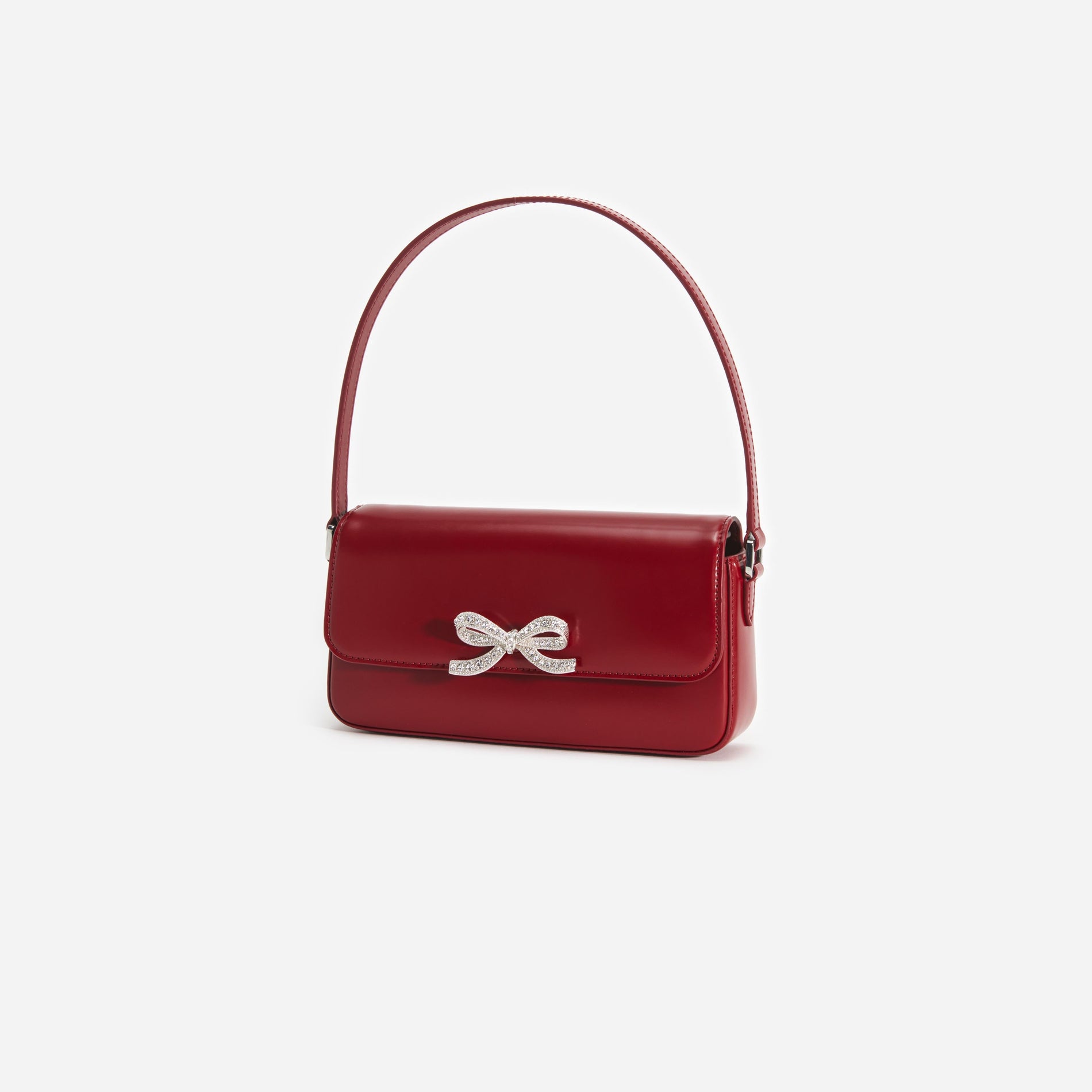 Side view of a woman wearing the Burgundy Leather Baguette Bag