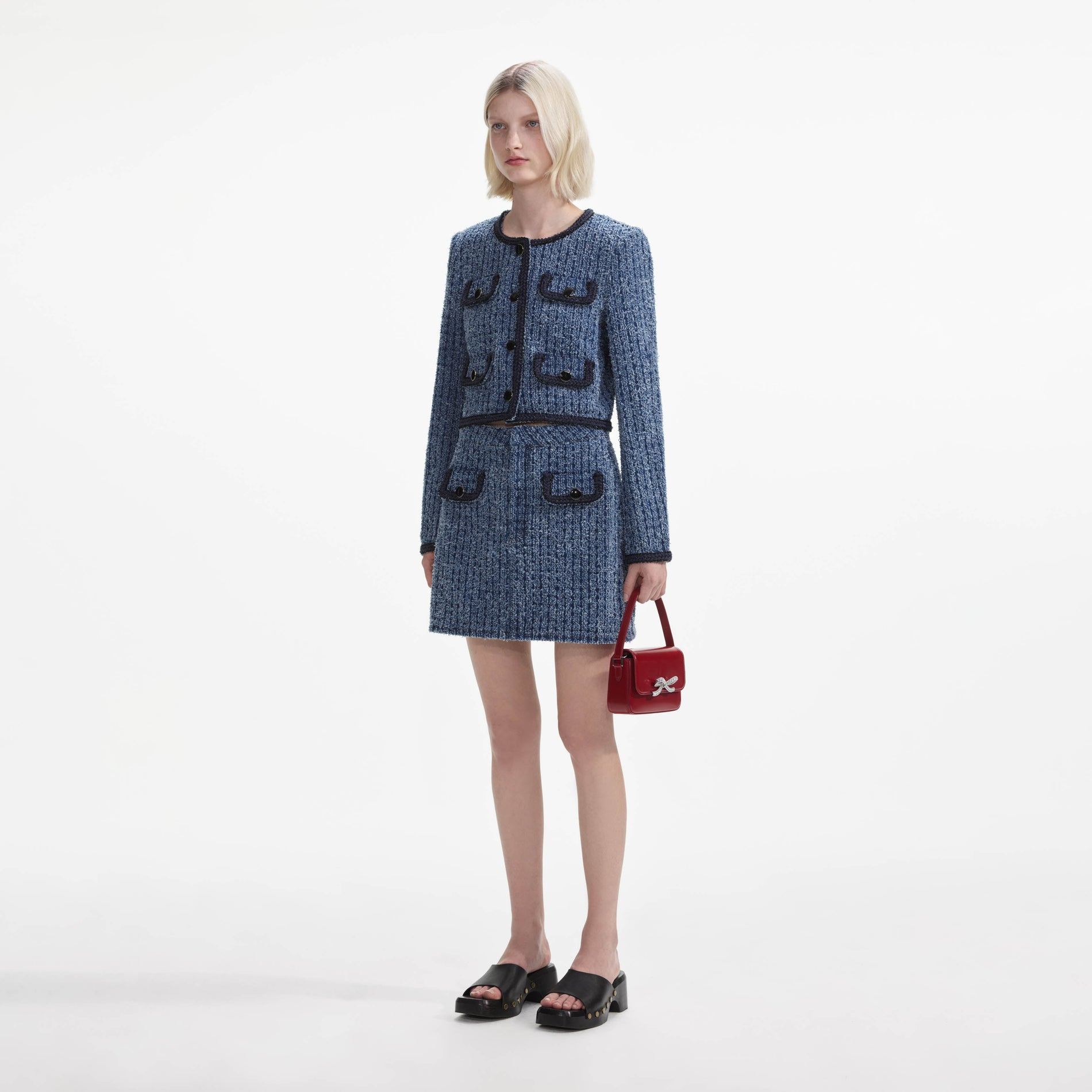 Side view of a woman wearing the Textured Denim Jacket