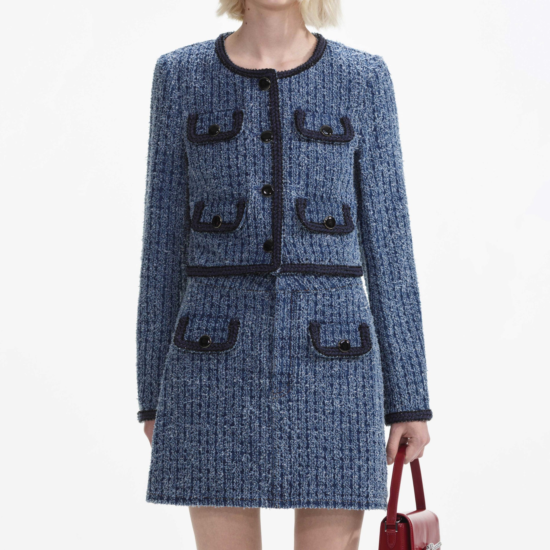 A close up of a woman wearing the Textured Denim Jacket