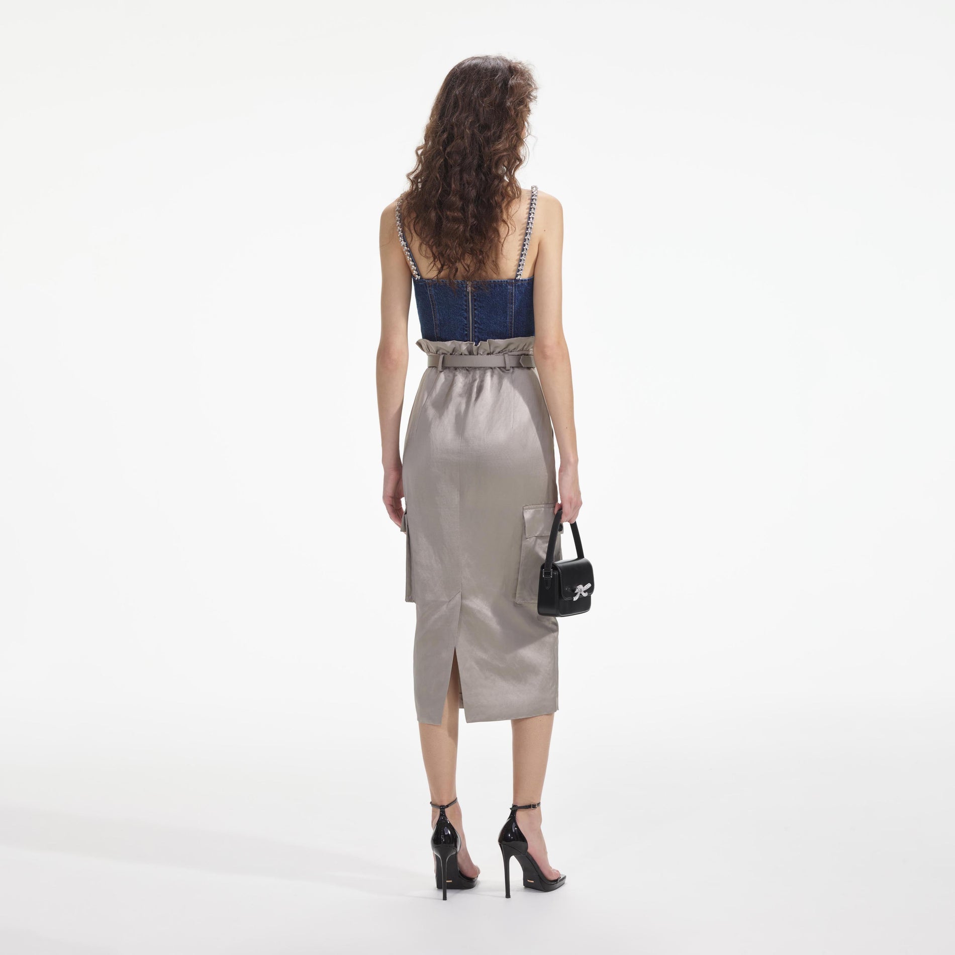 Back view of a woman wearing the Diamante Denim Top
