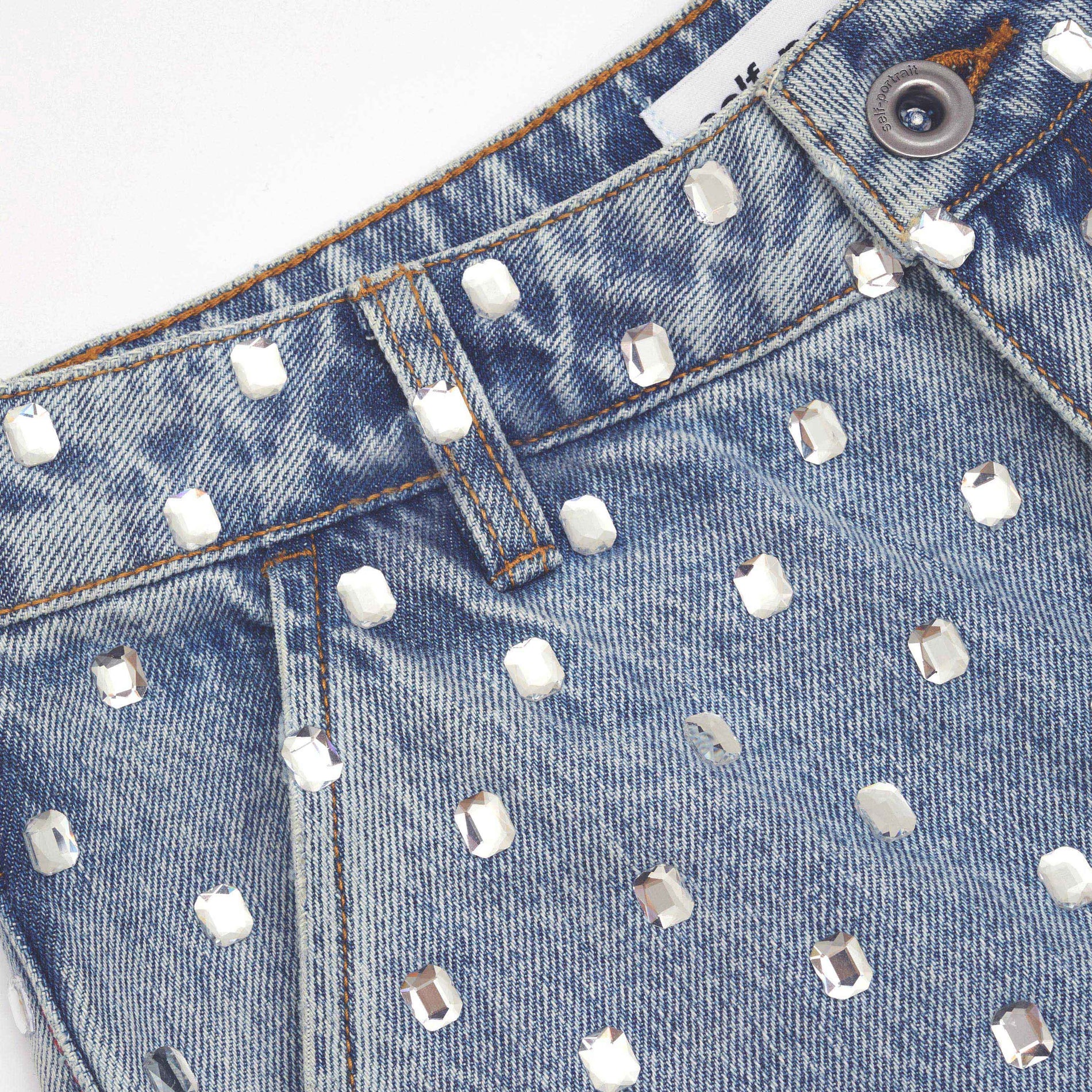 A close up of the fabric for the Square Rhinestone Denim Jeans