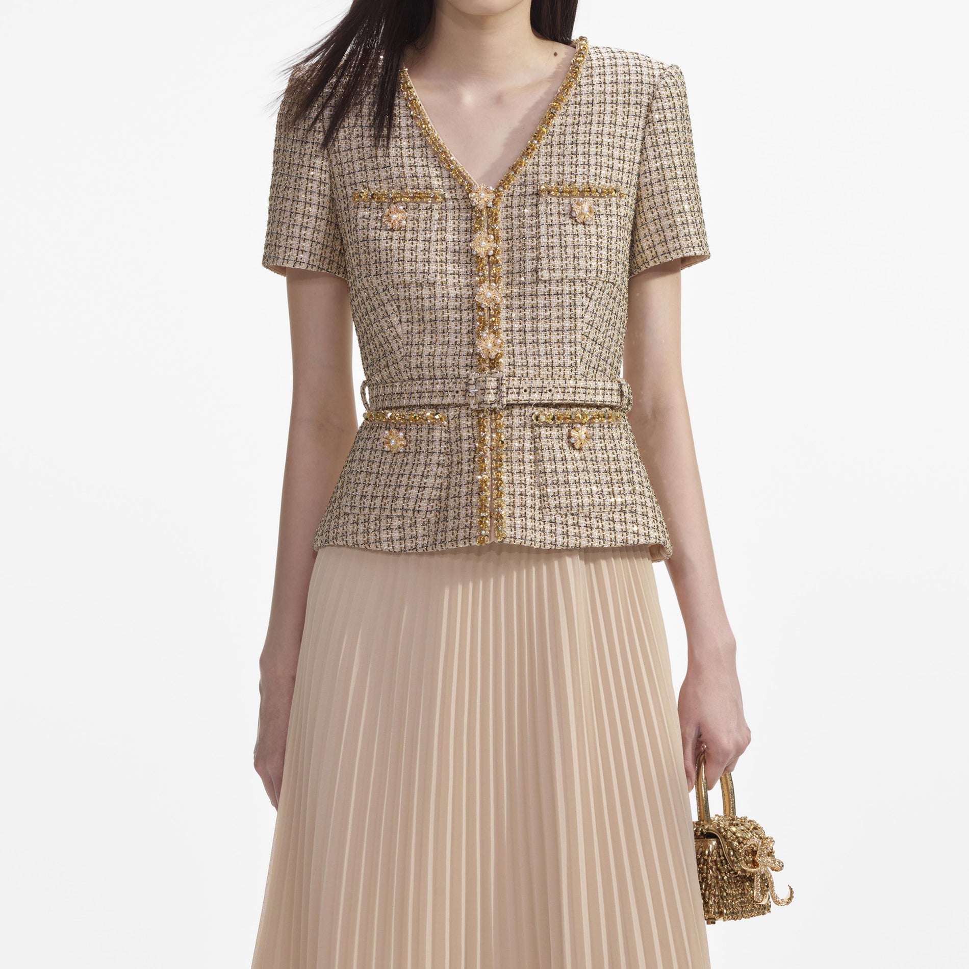 A close up of a woman wearing the Gold Boucle Midi Dress