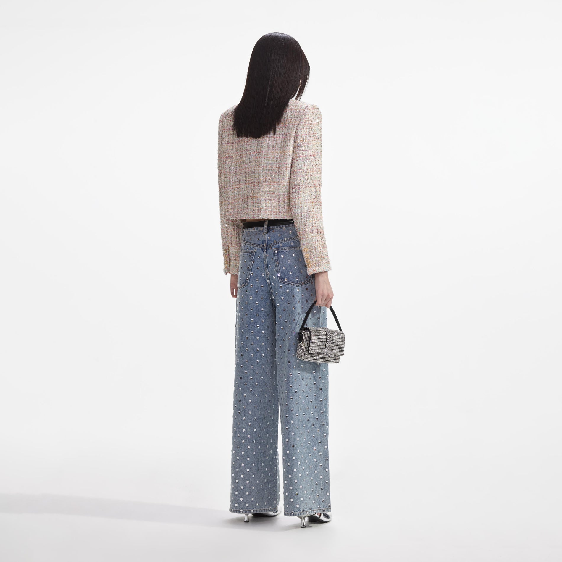 Back view of a woman wearing the Pastel Boucle Boxy Jacket