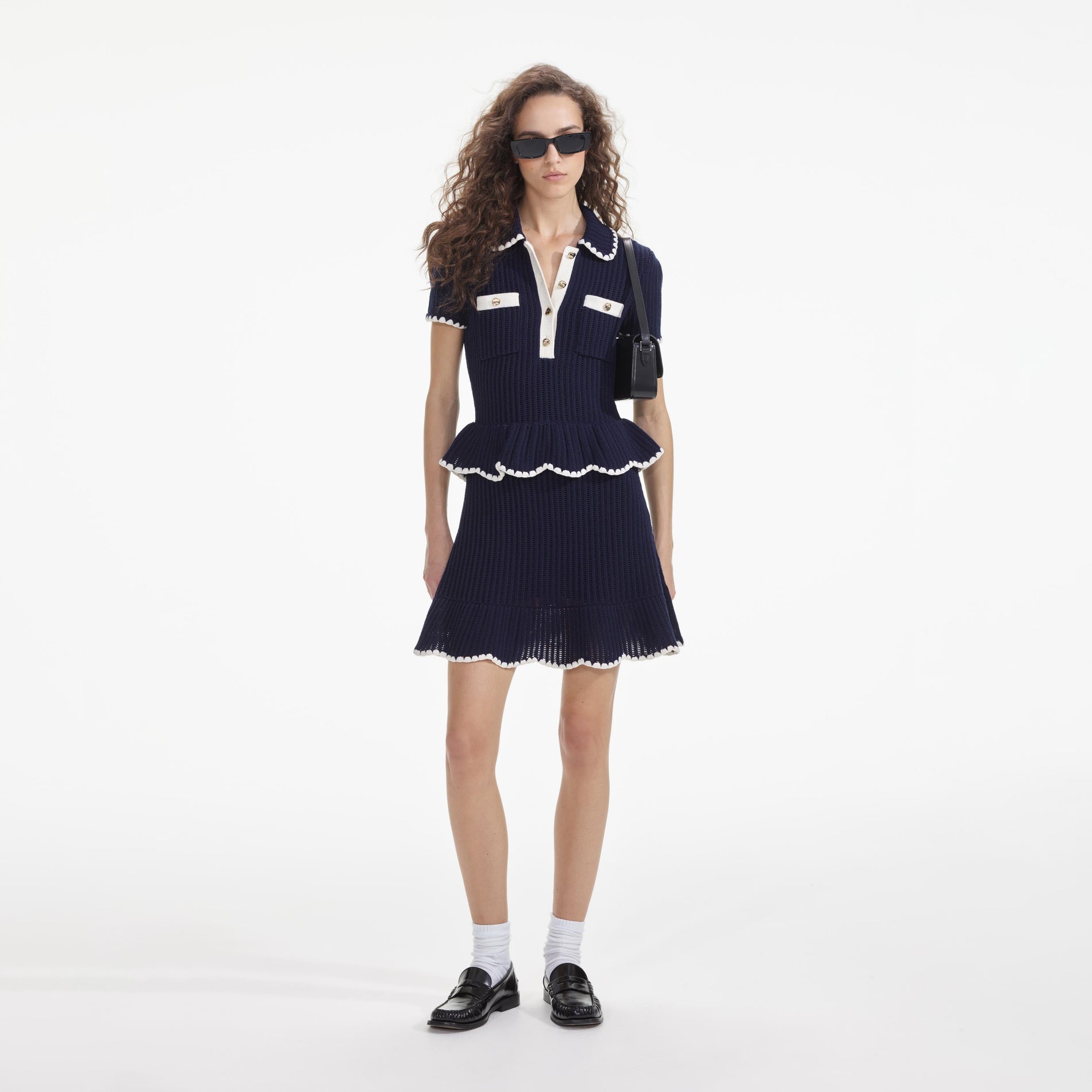 Front view of a woman wearing the Navy Crochet Flared Mini Dress