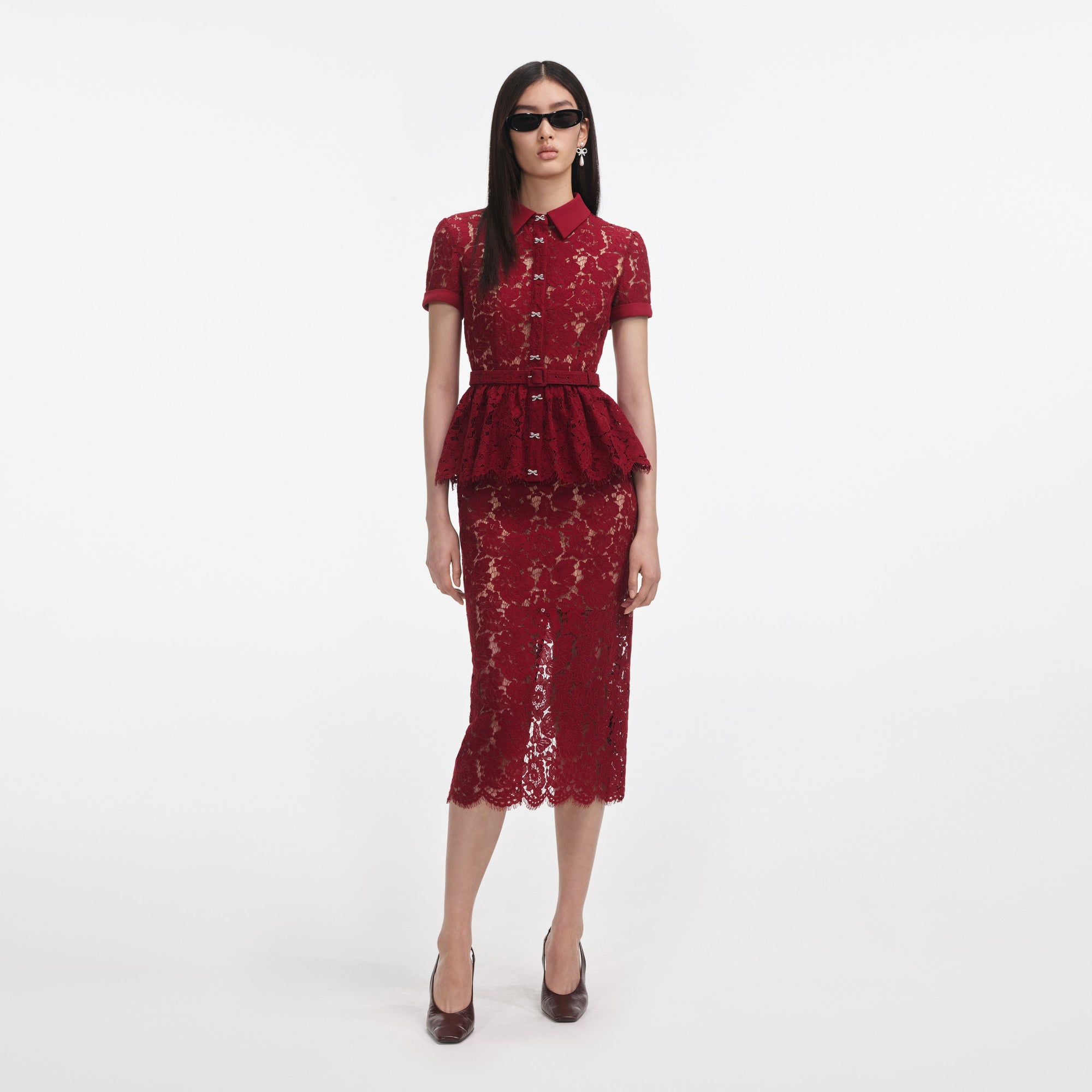 Front view of a woman wearing the Burgundy Lace Peplum Midi Dress