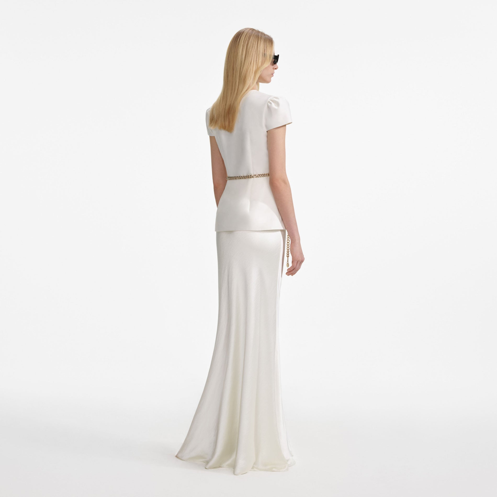 Back view of a woman wearing the Cream Taffeta Chain Belt Maxi Dress