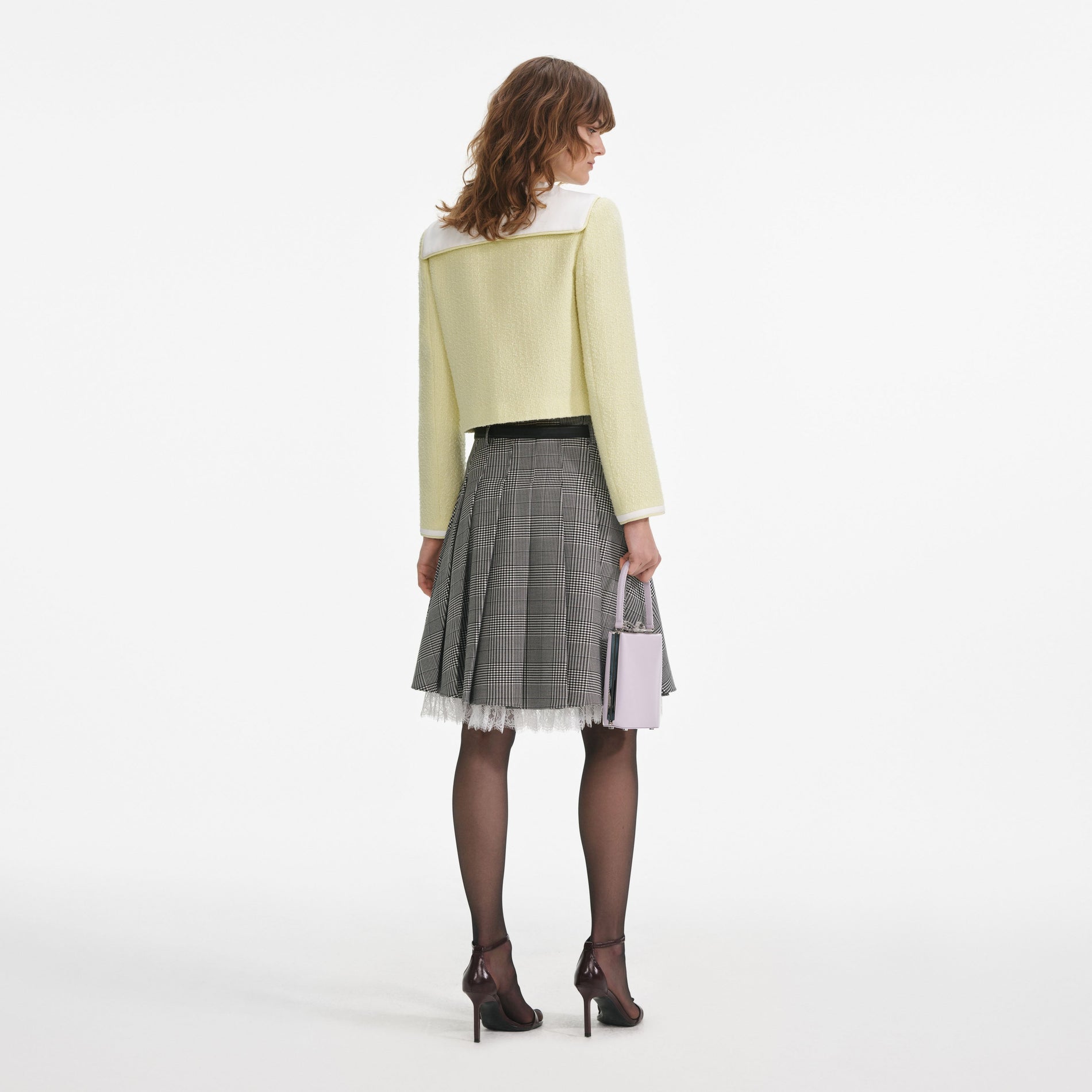 Back view of a woman wearing the Yellow Boucle Contrast Collar Jacket