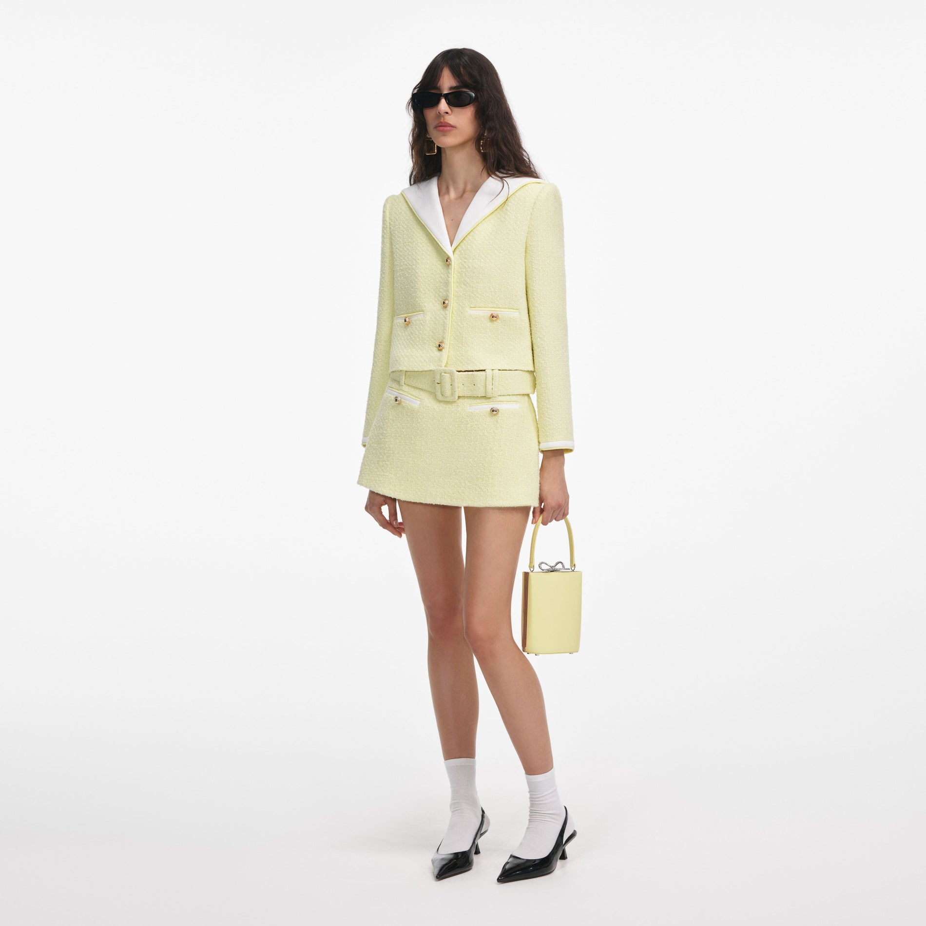 Side view of a woman wearing the Yellow Boucle Skort