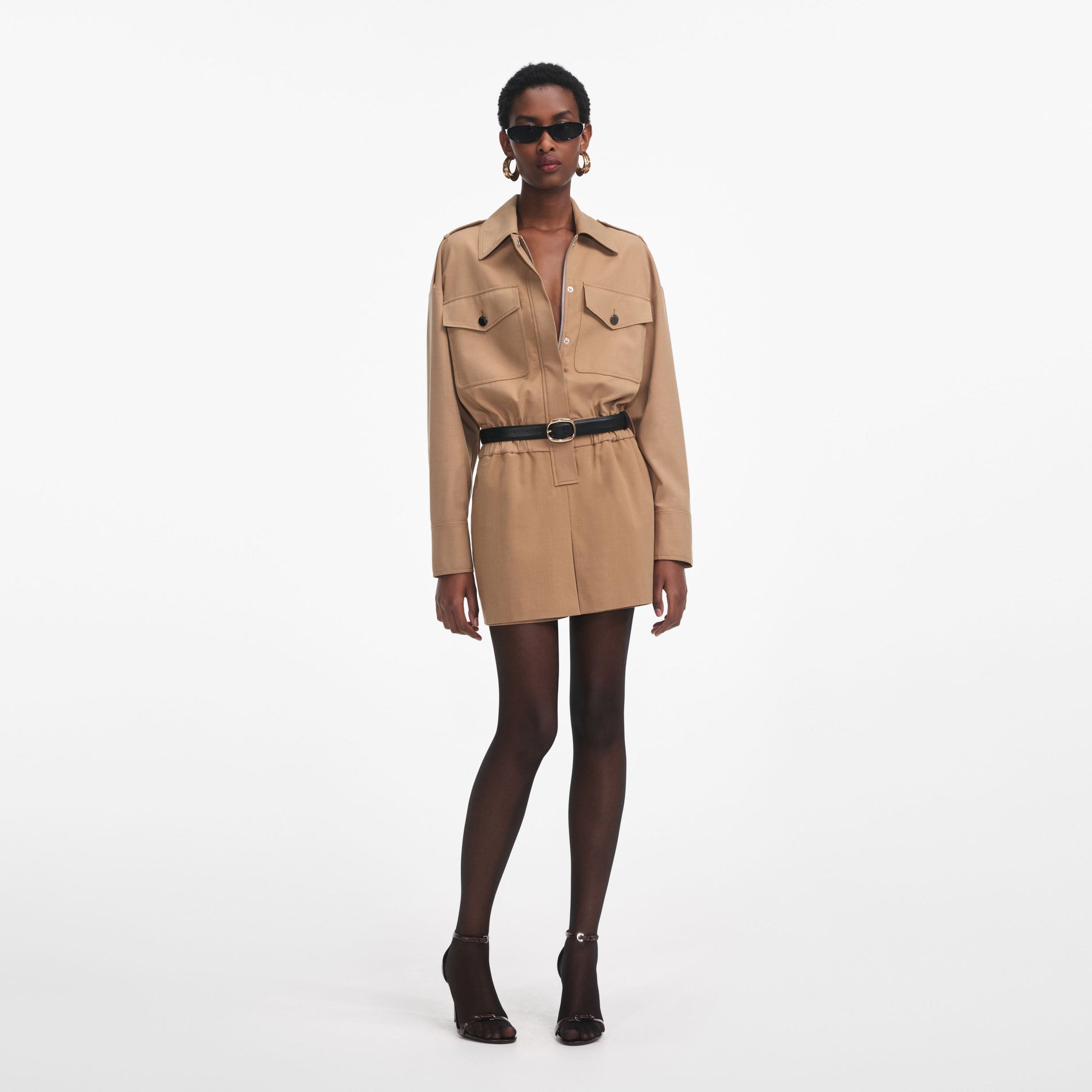 Front view of a woman wearing the Tan Twill Playsuit