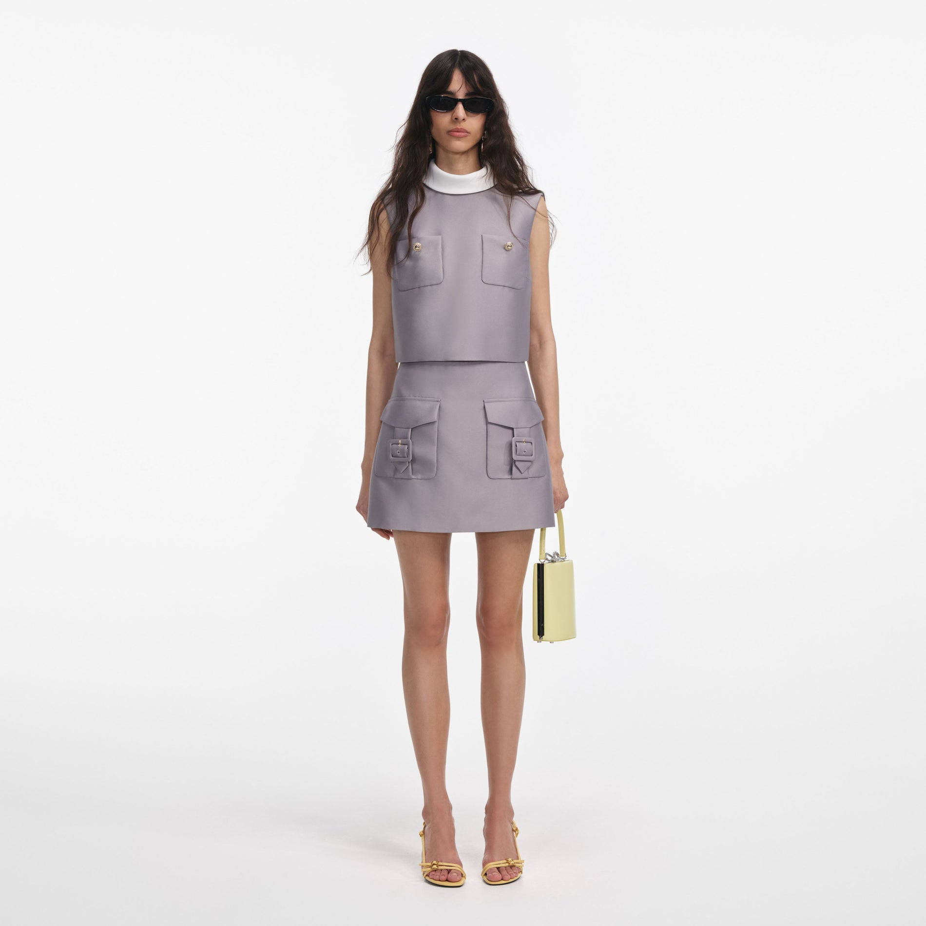 Front view of a woman wearing the Grey Taffeta Mini Skirt