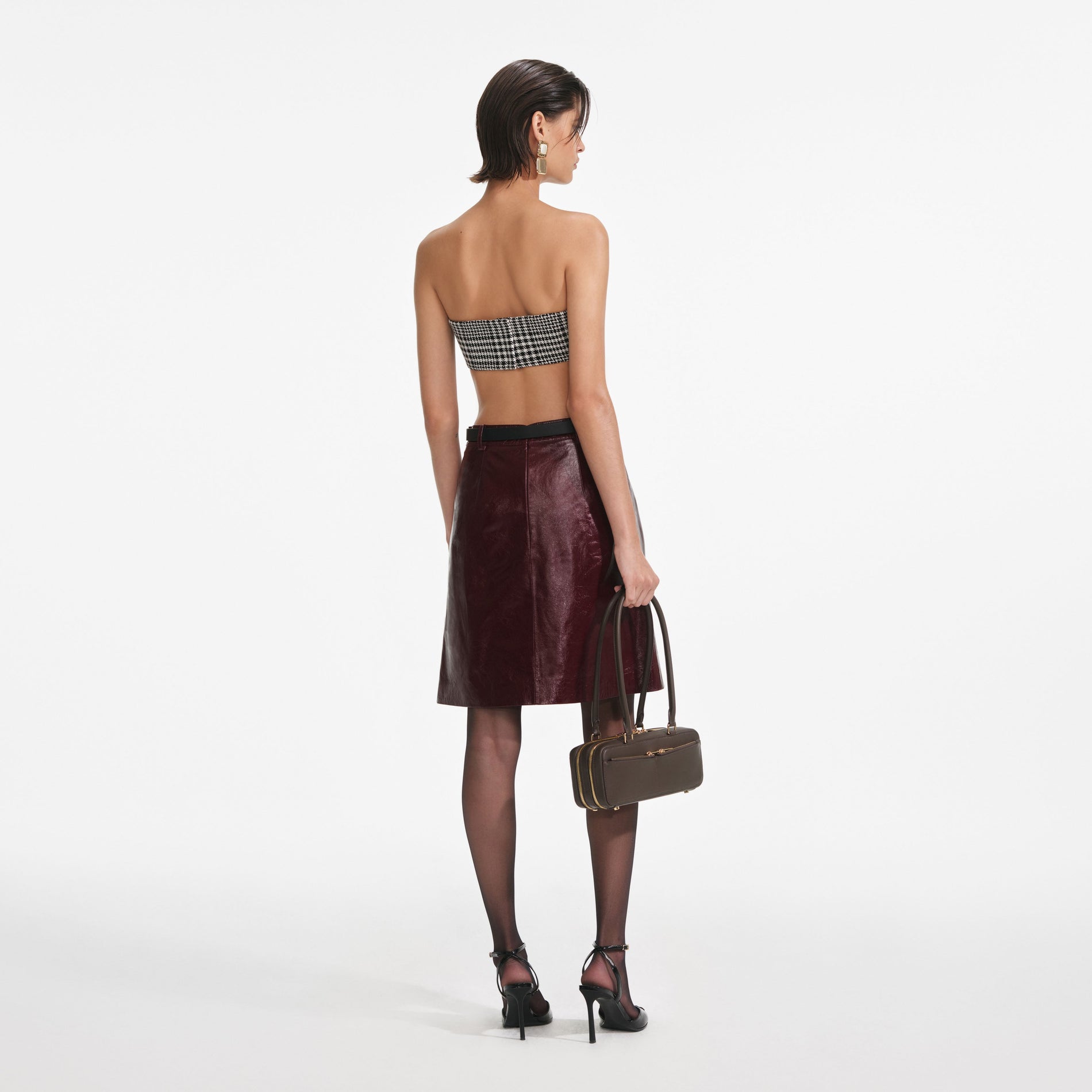 Back view of a woman wearing the Houndstooth Bandeau Top