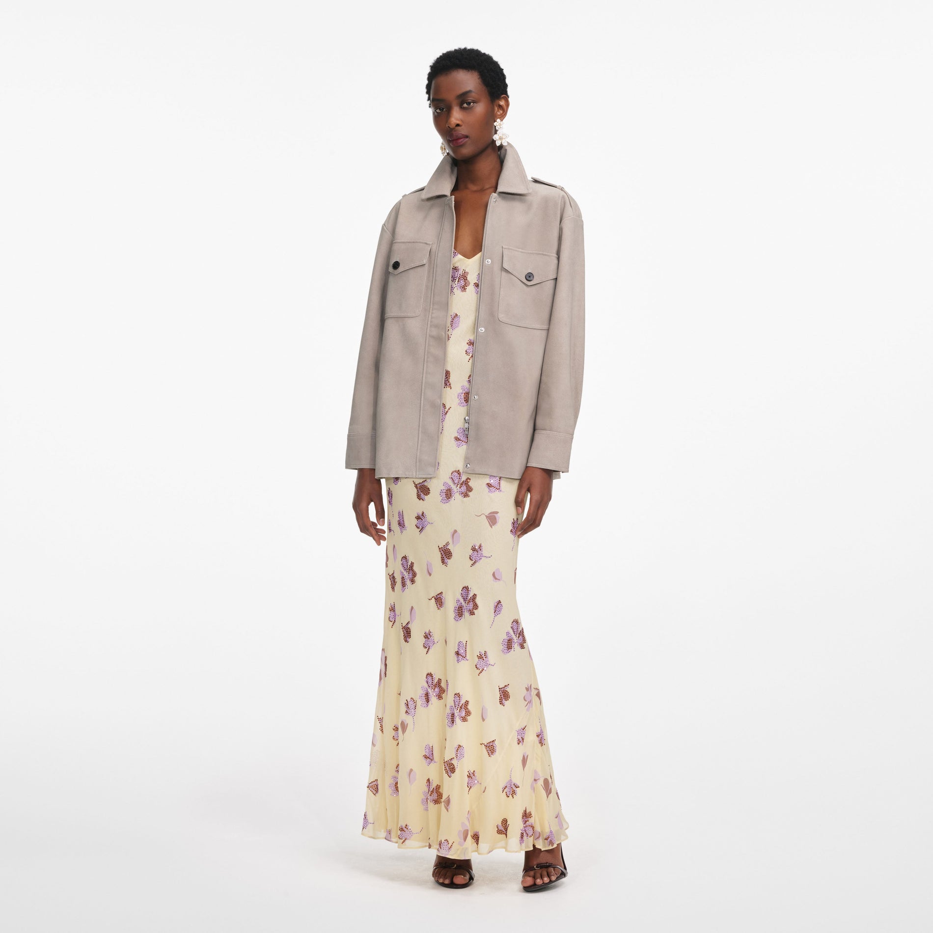 Side view of a woman wearing the Grey Suede Jacket