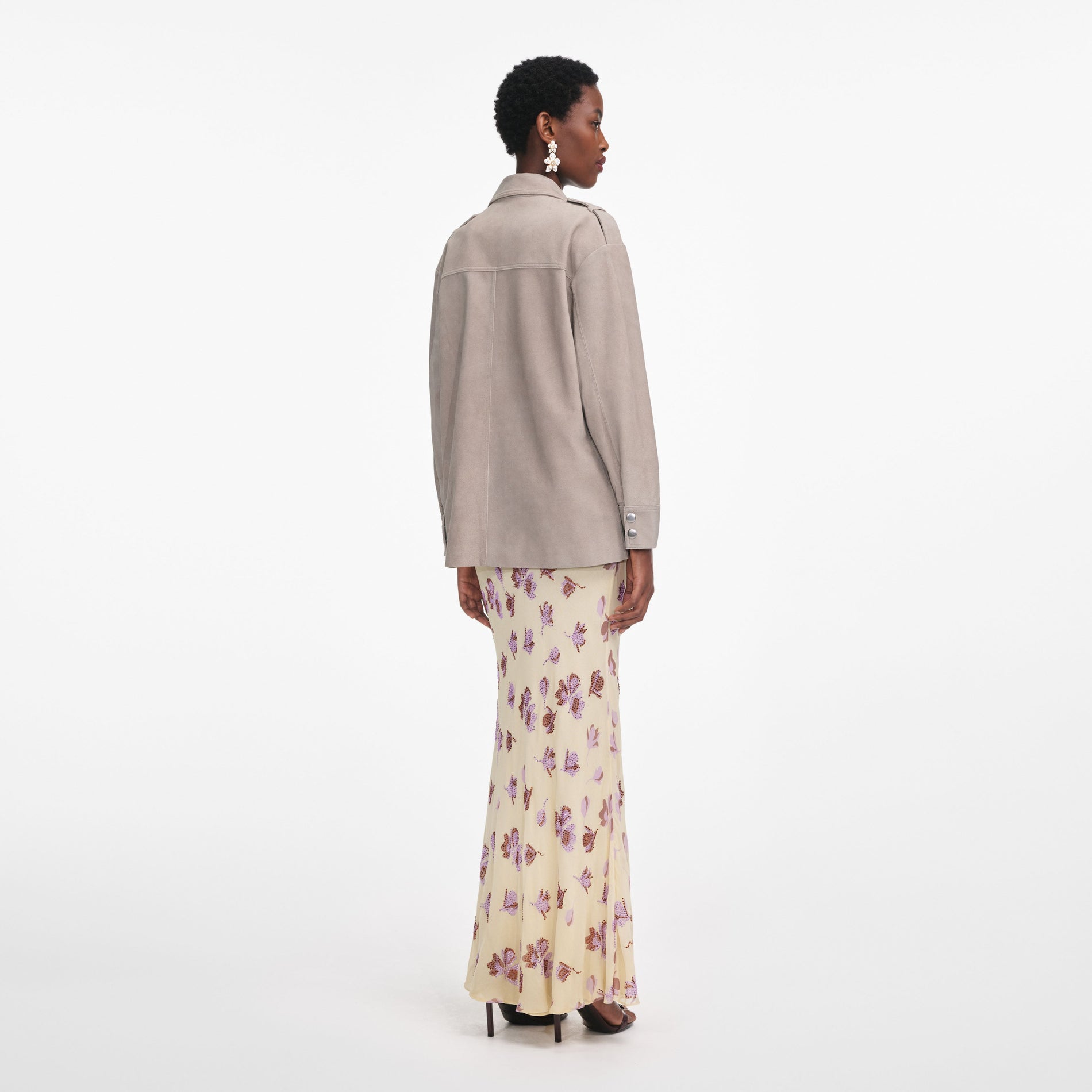 Back view of a woman wearing the Grey Suede Jacket