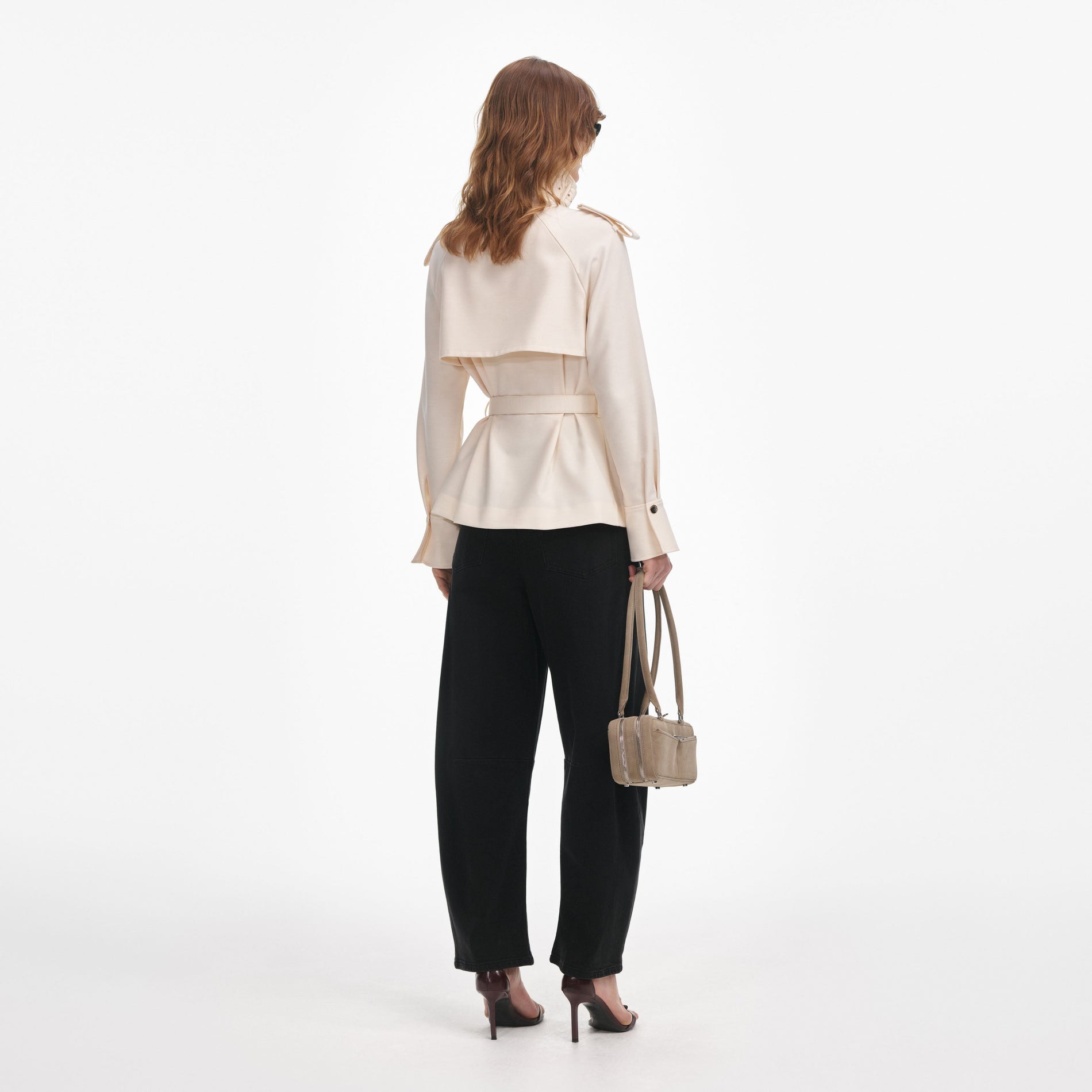 Back view of a woman wearing the Cream Twill Jacket