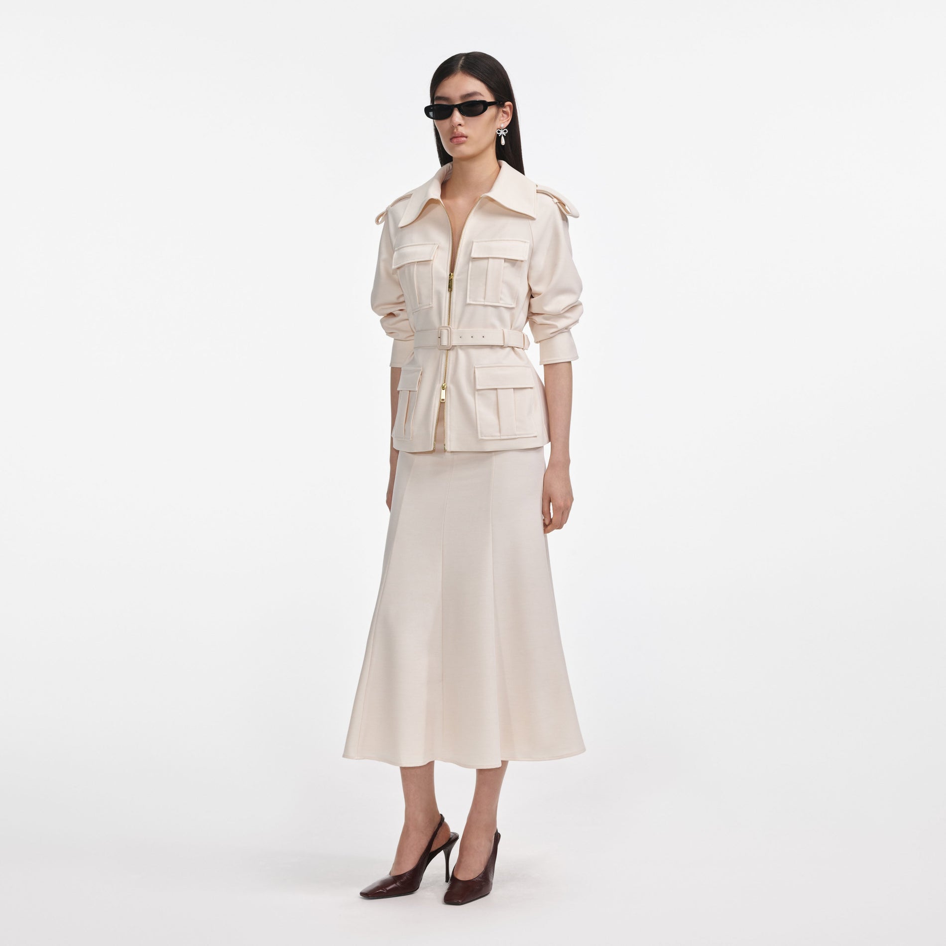 Side view of a woman wearing the Cream Twill Midi Dress