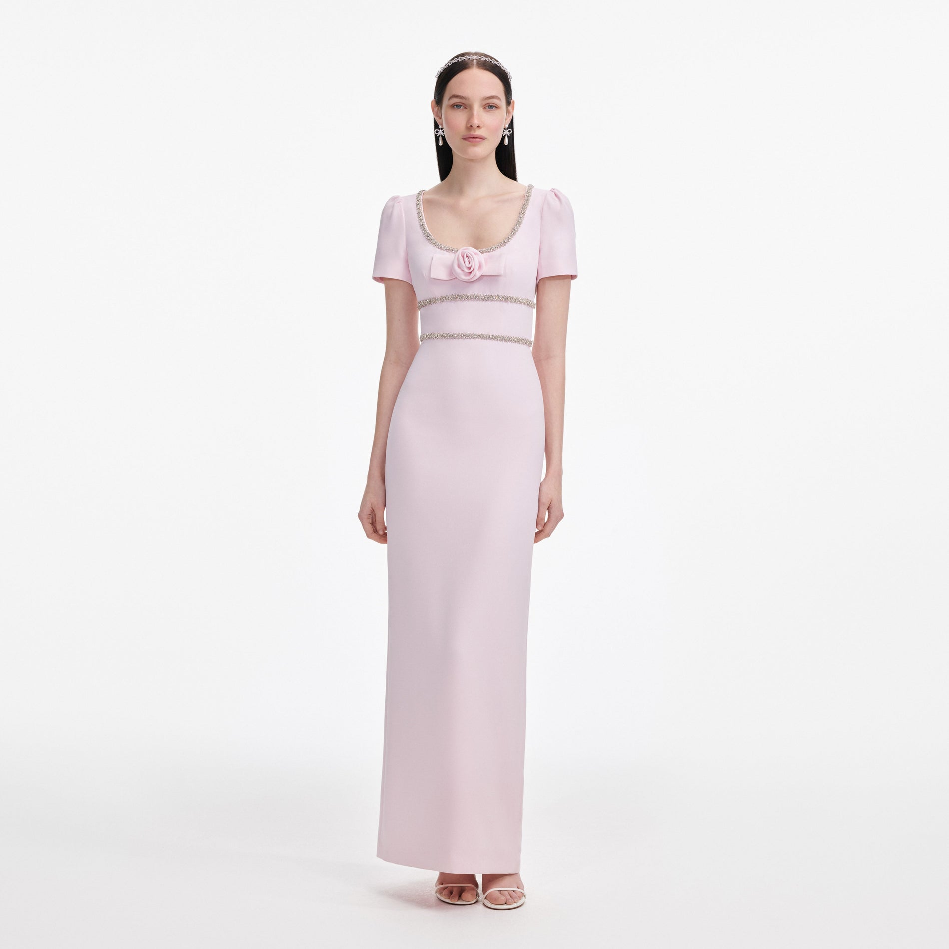Front view of a woman wearing the Pink Crepe Crystal Trim Maxi Dress