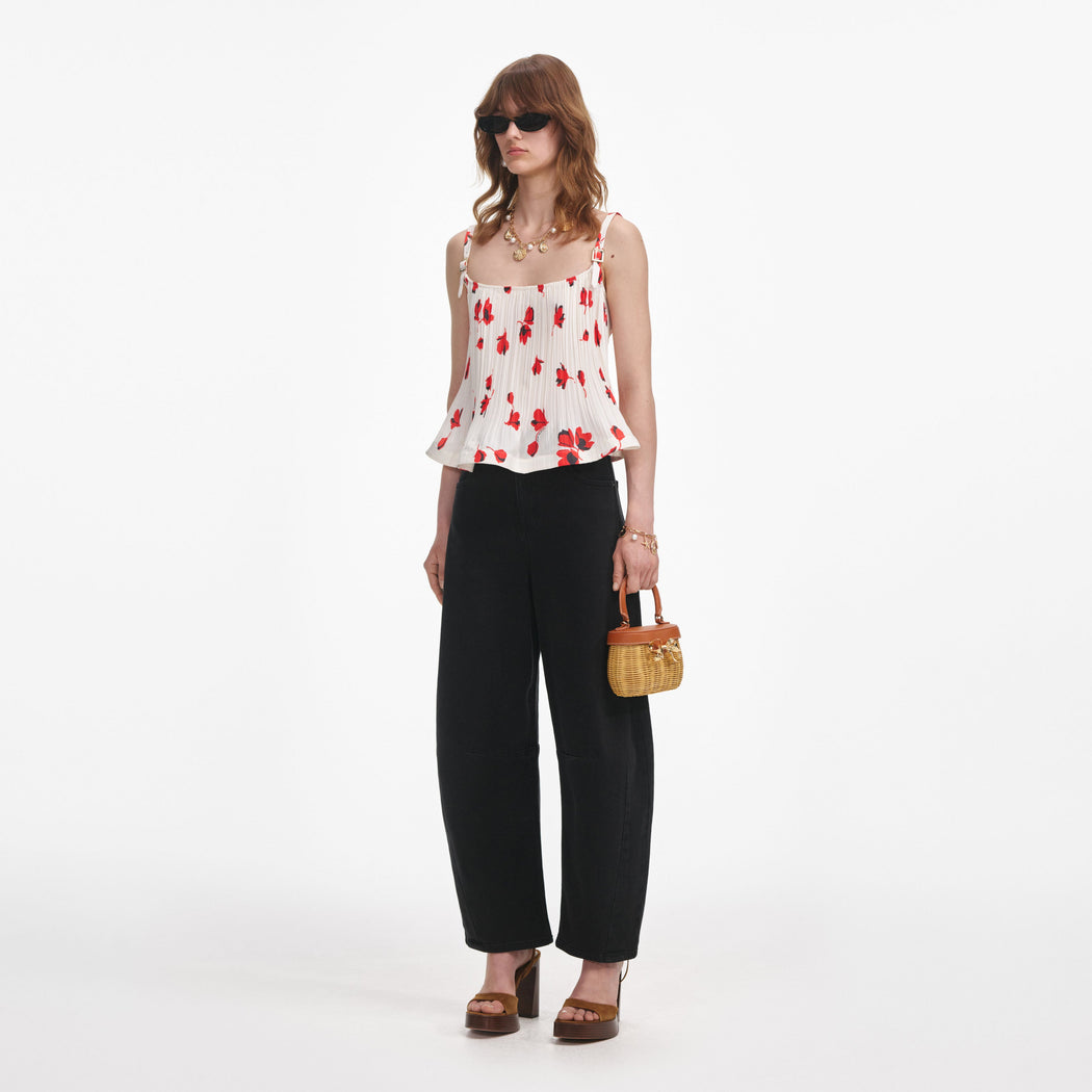 Side view of a woman wearing the White Floral Plisse Top