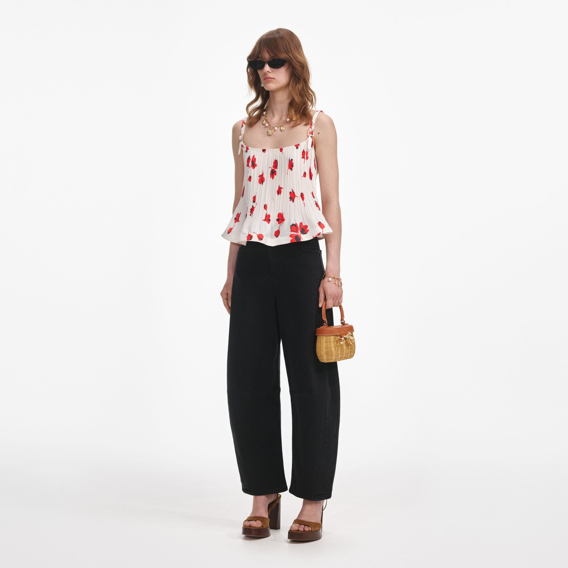 Side view of a woman wearing the White Floral Plisse Top