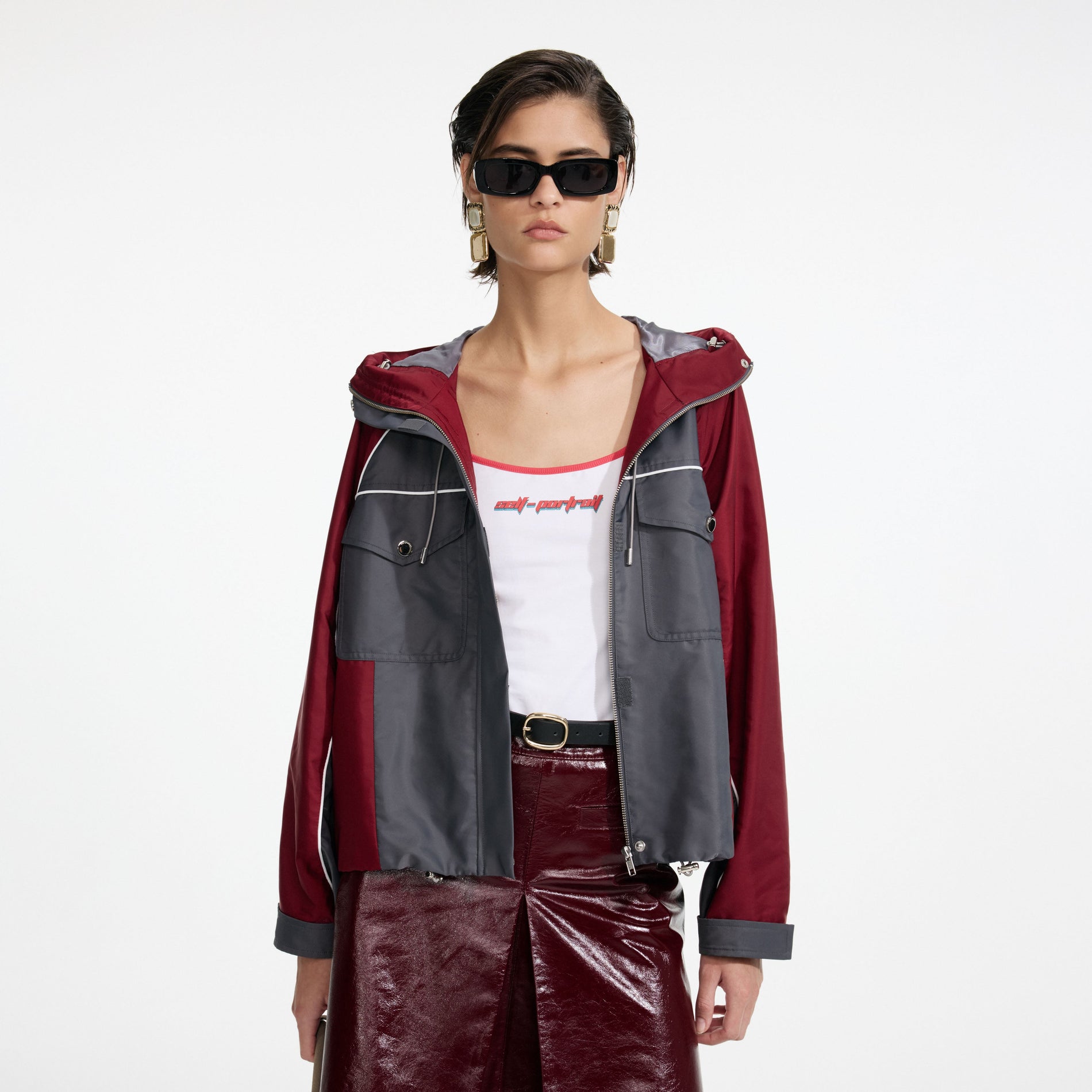 A close up of a woman wearing the Dark Grey Nylon Windbreaker