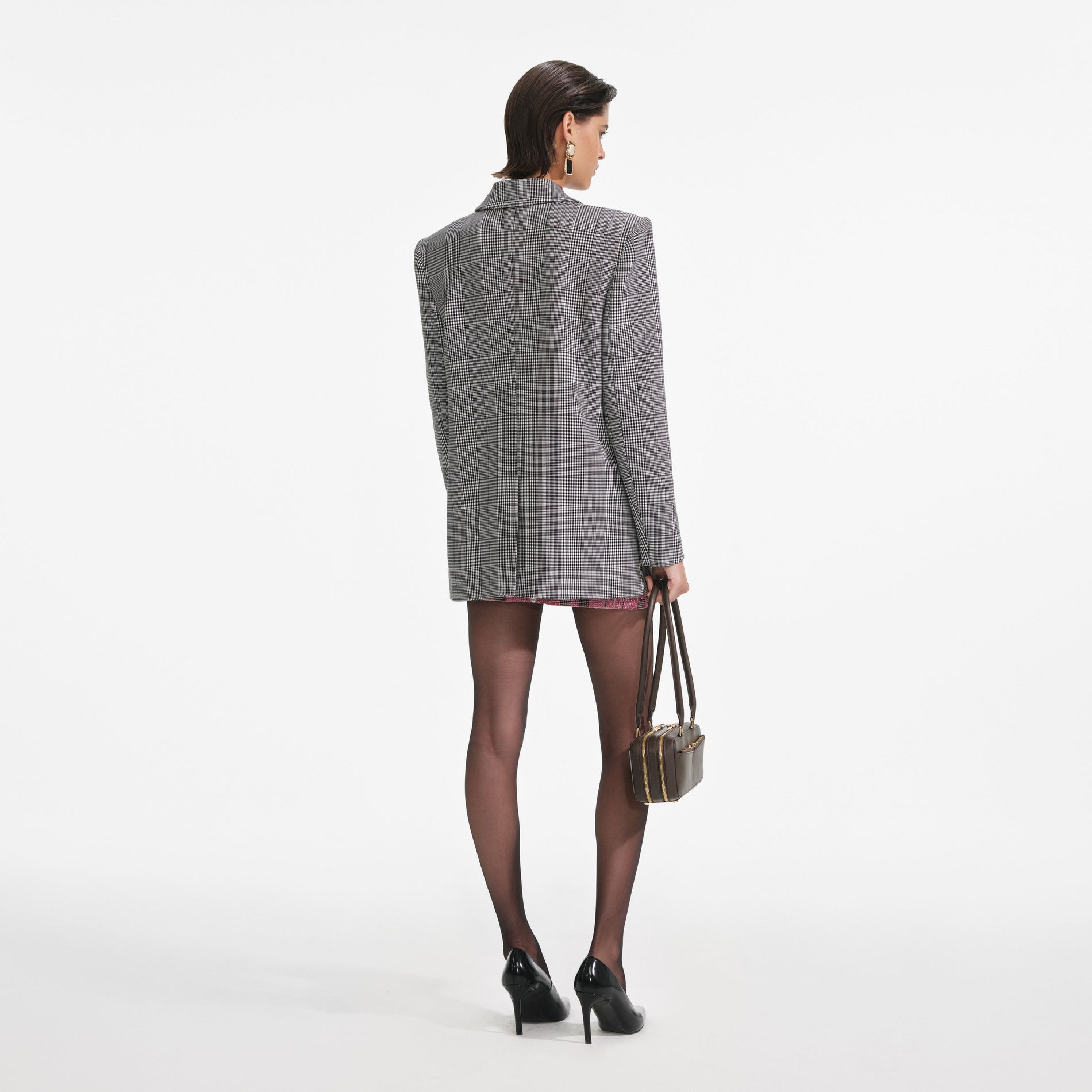 Back view of a woman wearing the Prince Of Wales Check Blazer