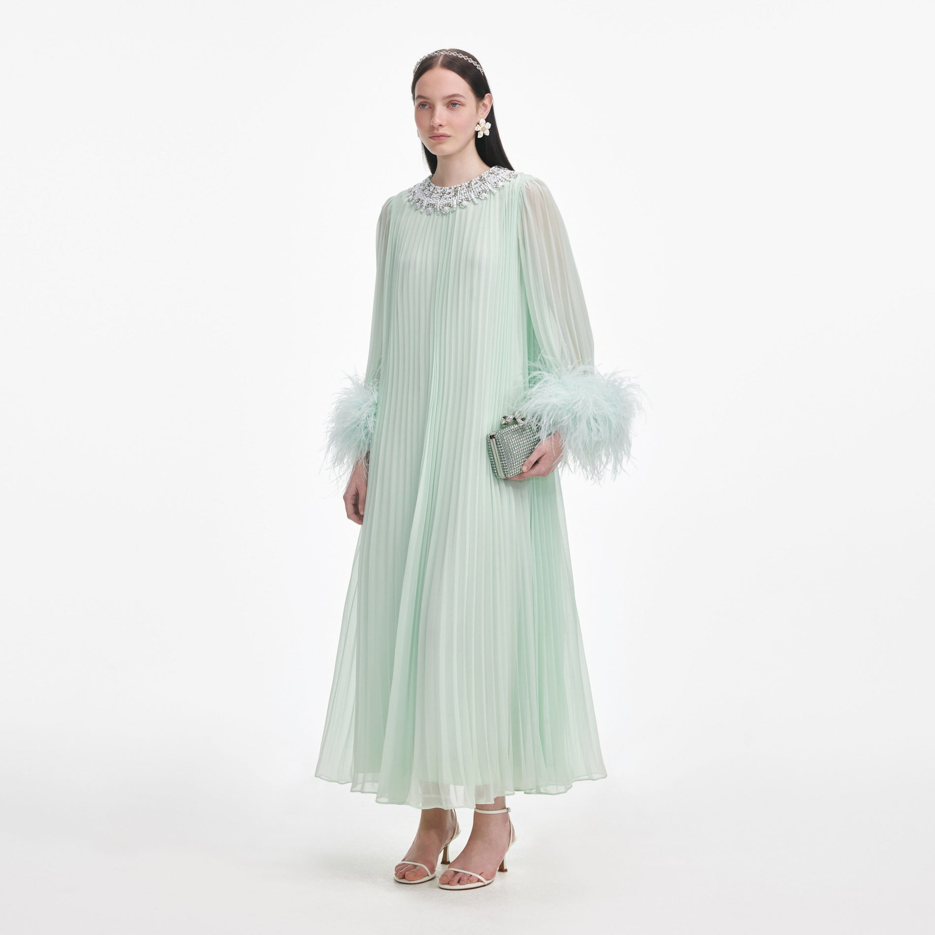 Side view of a woman wearing the Mint Chiffon Feather Midi Dress