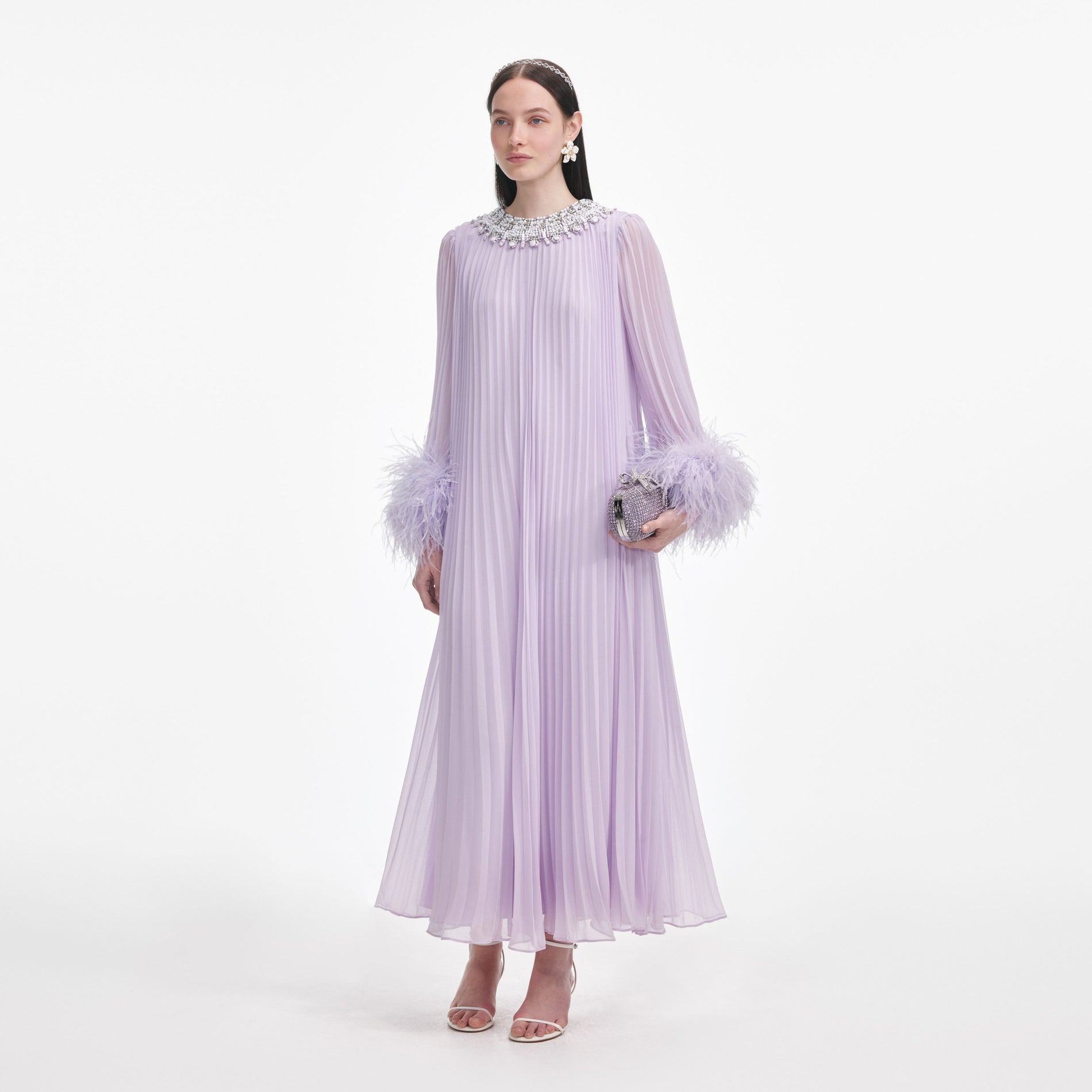 Side view of a woman wearing the Lilac Chiffon Feather Midi Dress
