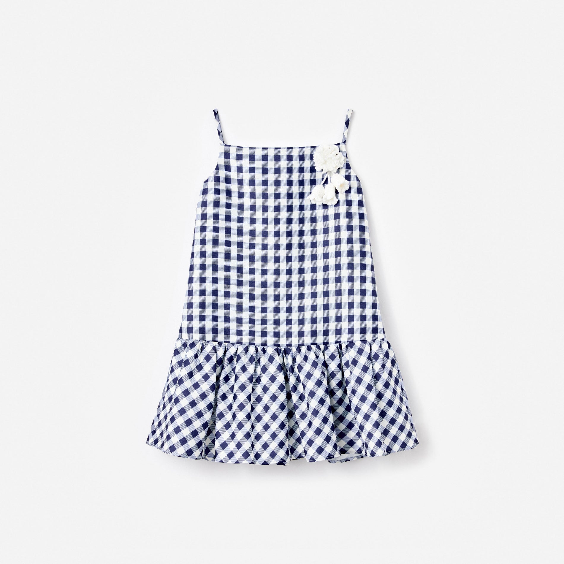 Blue and white gingham dress with spaghetti straps and white pom-pom details