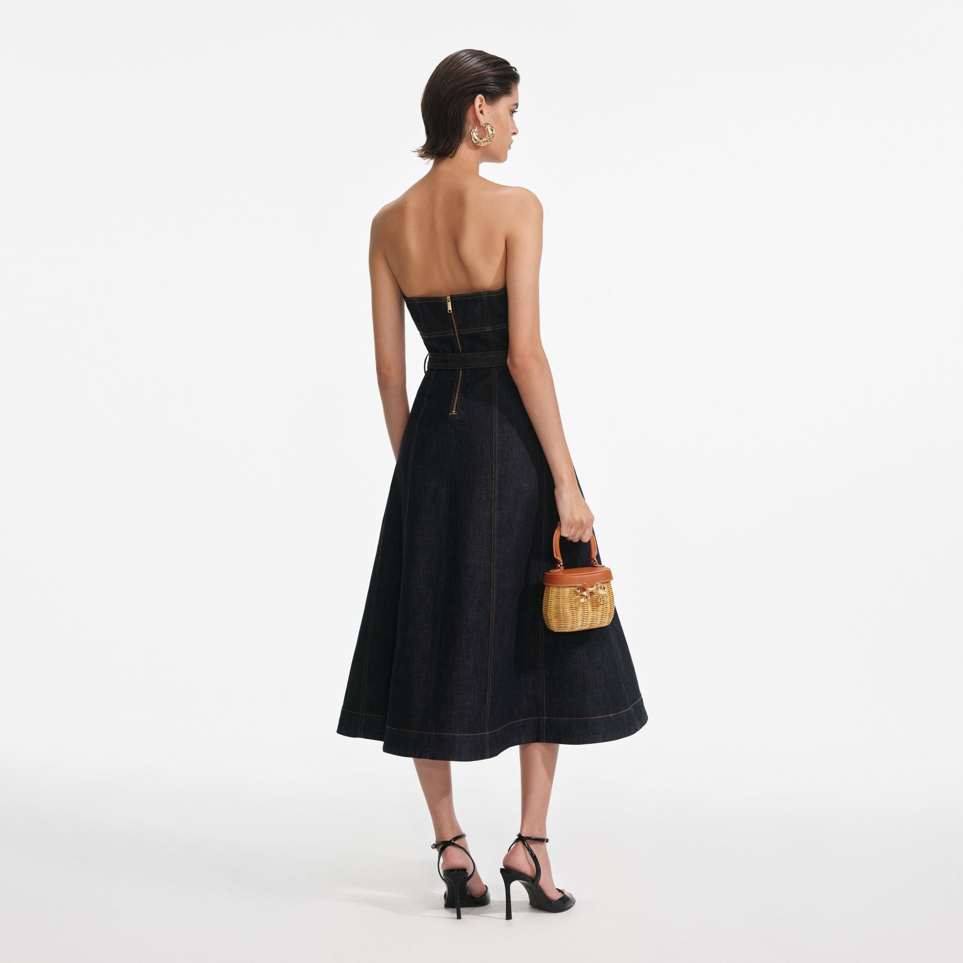 Back view of a woman wearing the Indigo Denim Bandeau Midi Dress