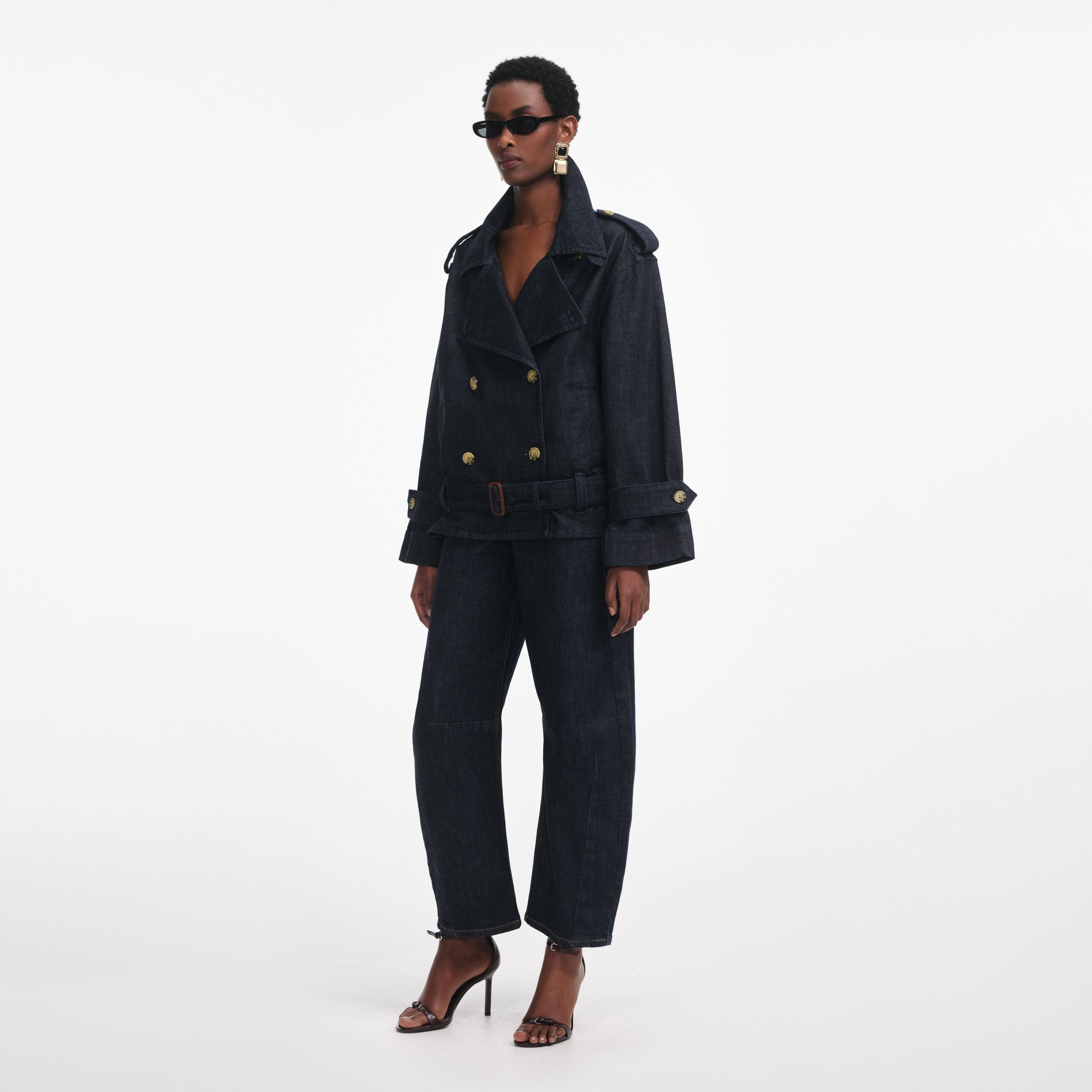 Side view of a woman wearing the Denim Trench Jacket