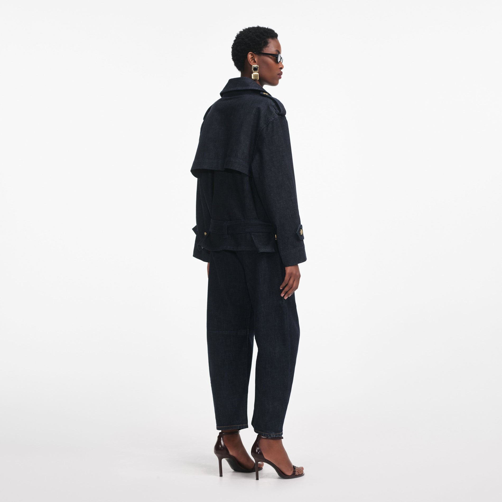 Back view of a woman wearing the Denim Trench Jacket
