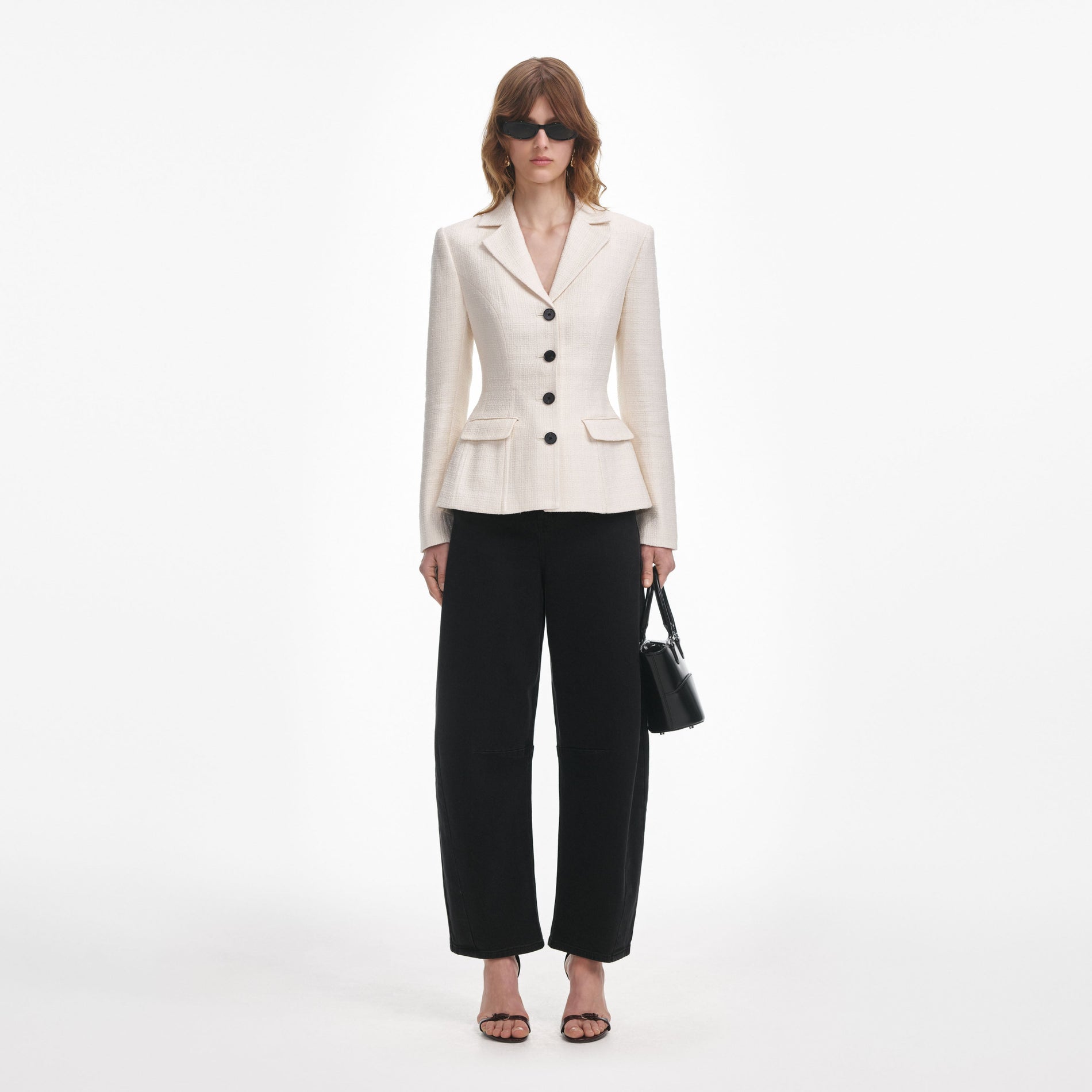 Front view of a woman wearing the Cream Boucle Jacket