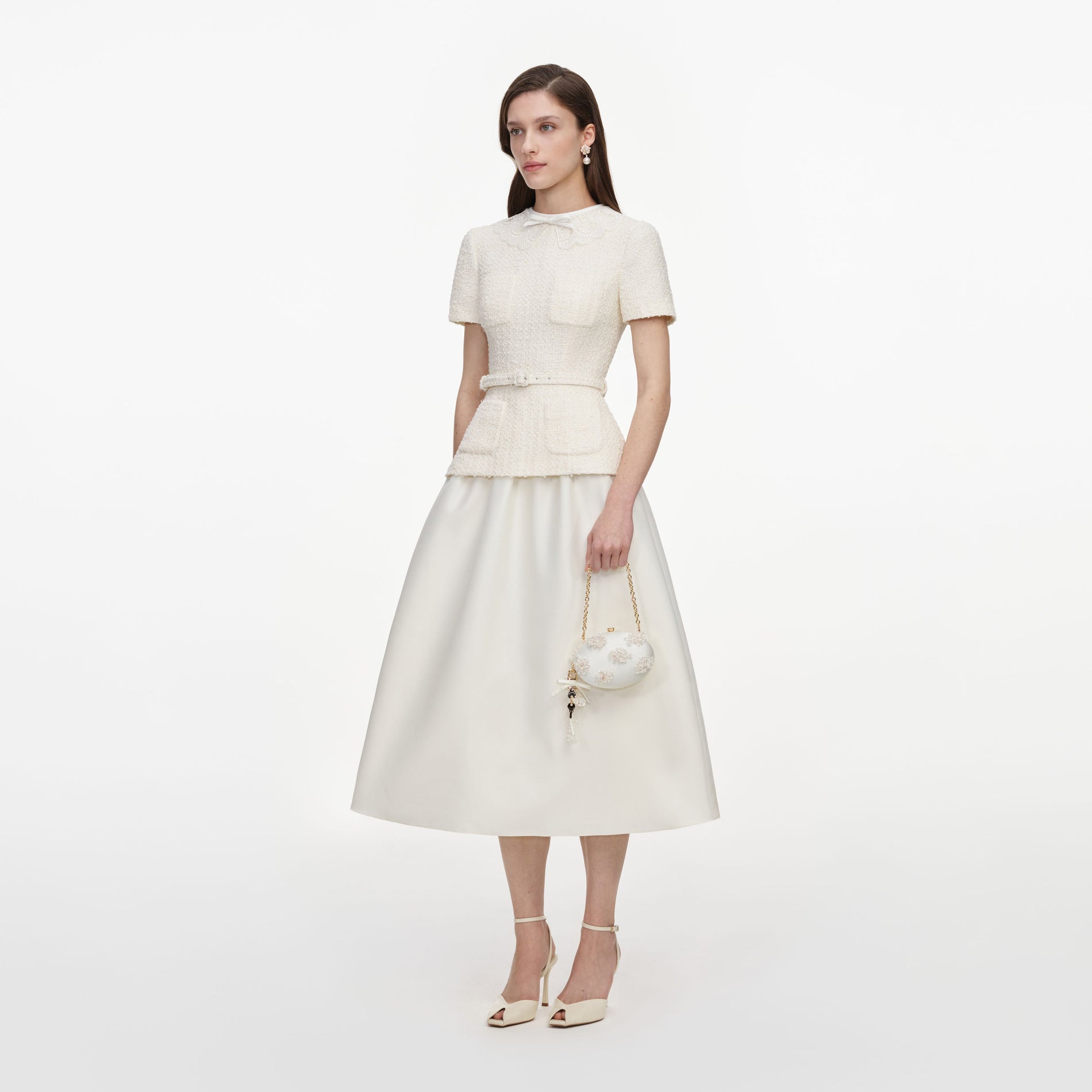 Side view of a woman wearing the Cream Boucle Taffeta Midi Dress