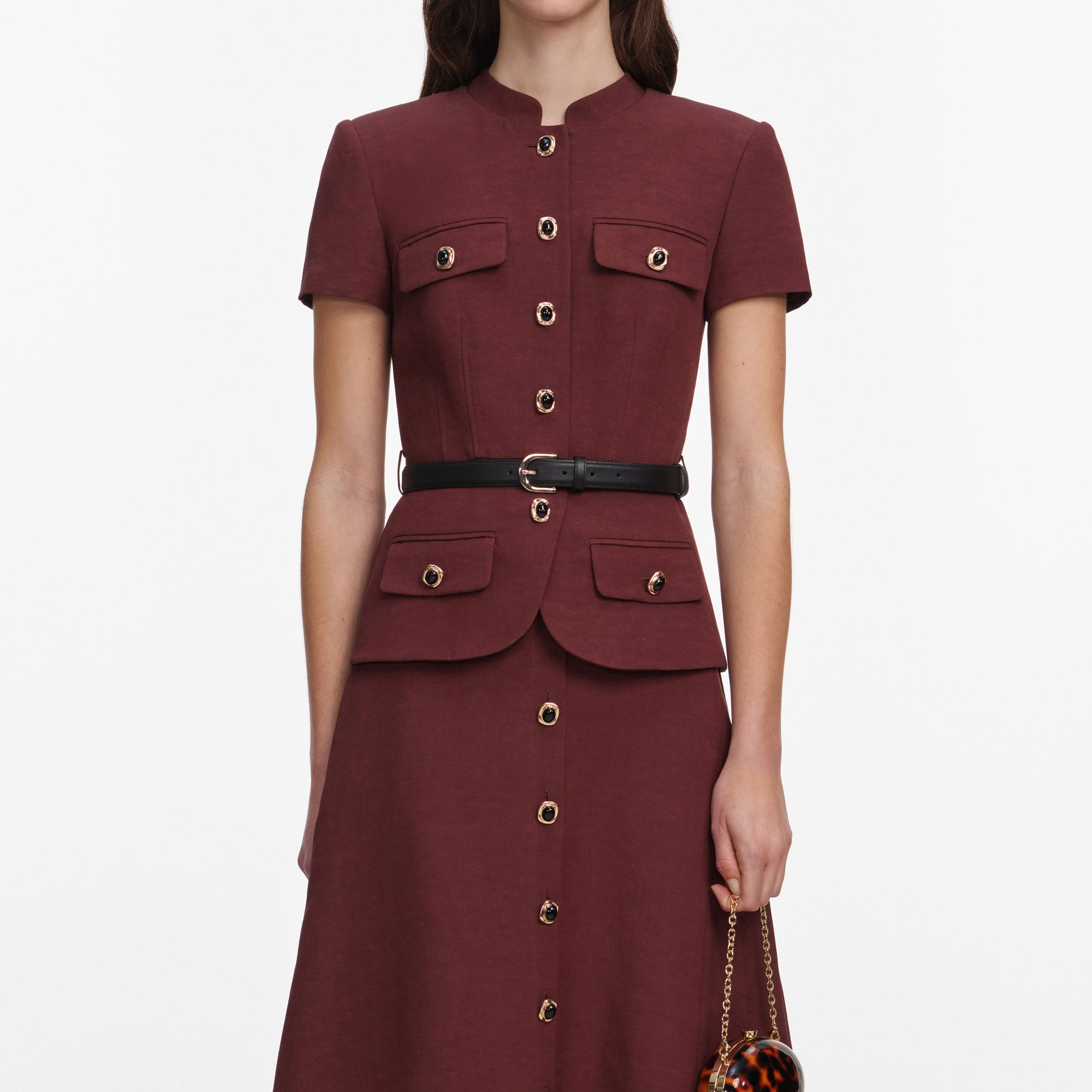 A close up of a woman wearing the Brown Peplum Linen Blend Midi Dress