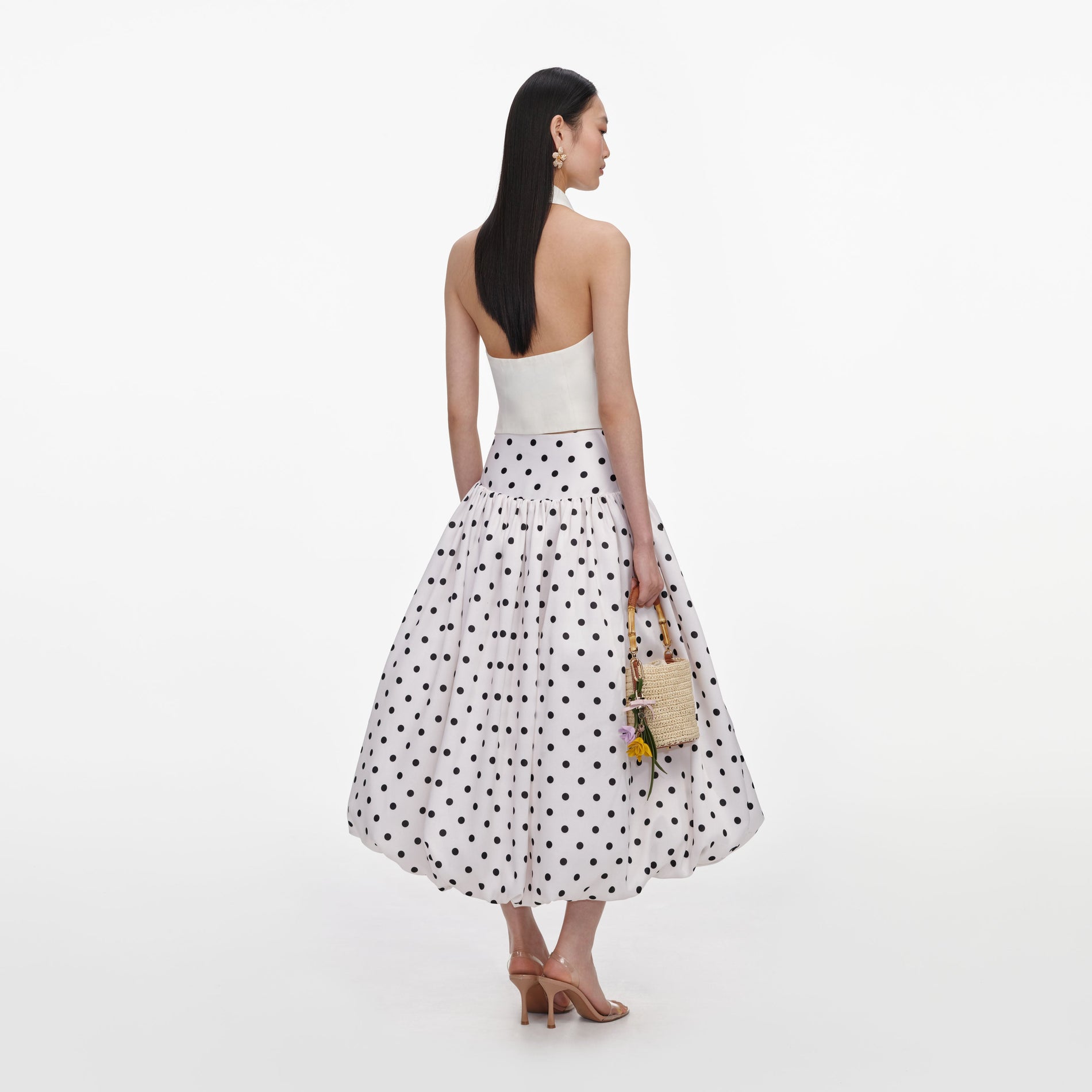 Back view of a woman wearing the Cream Linen Blend Waistcoat