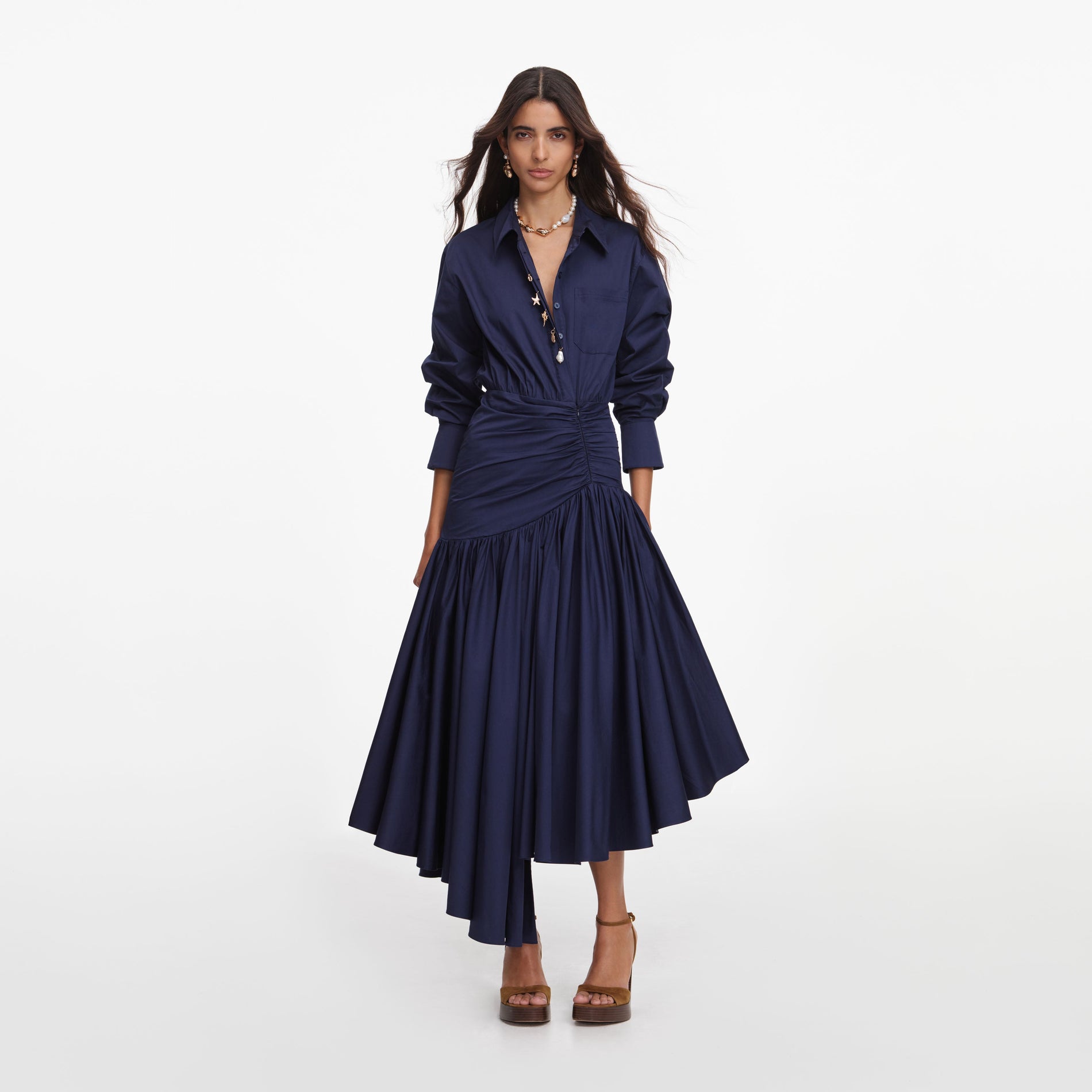 Front view of a woman wearing the Navy Cotton Asymmetric Midi Dress