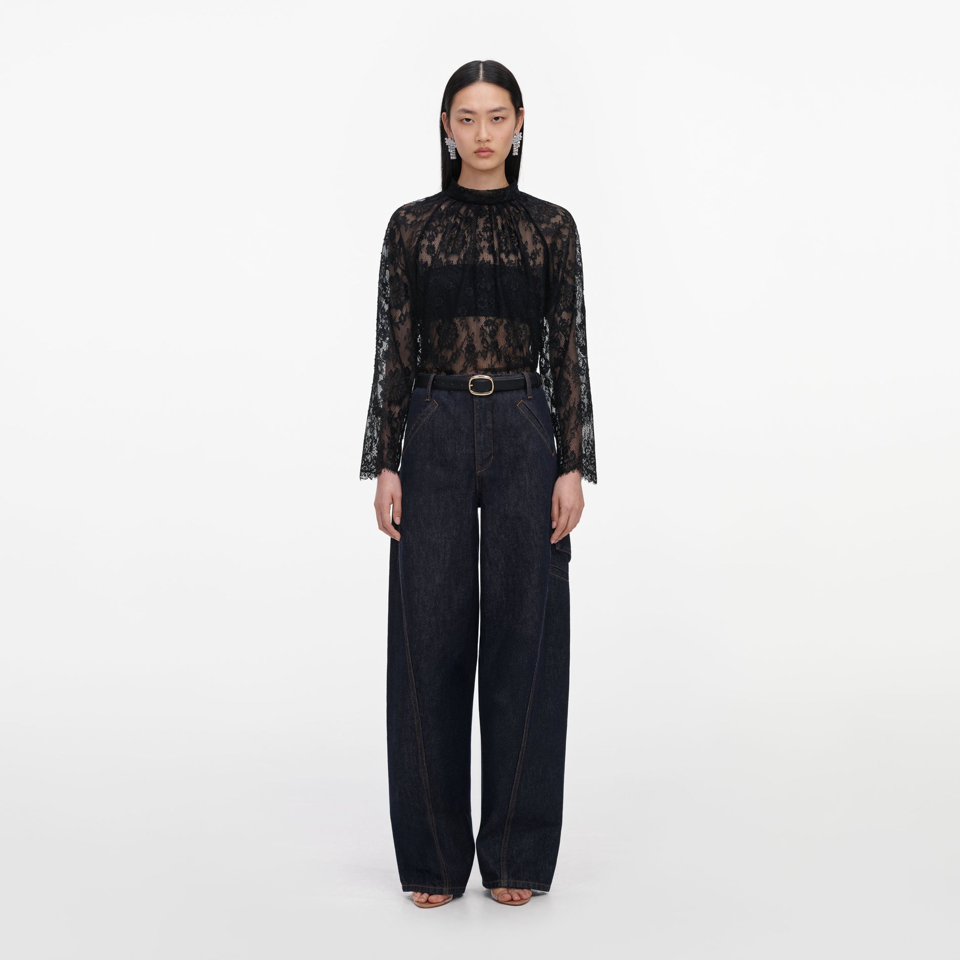 Front view of a woman wearing the Black Lace Blouse