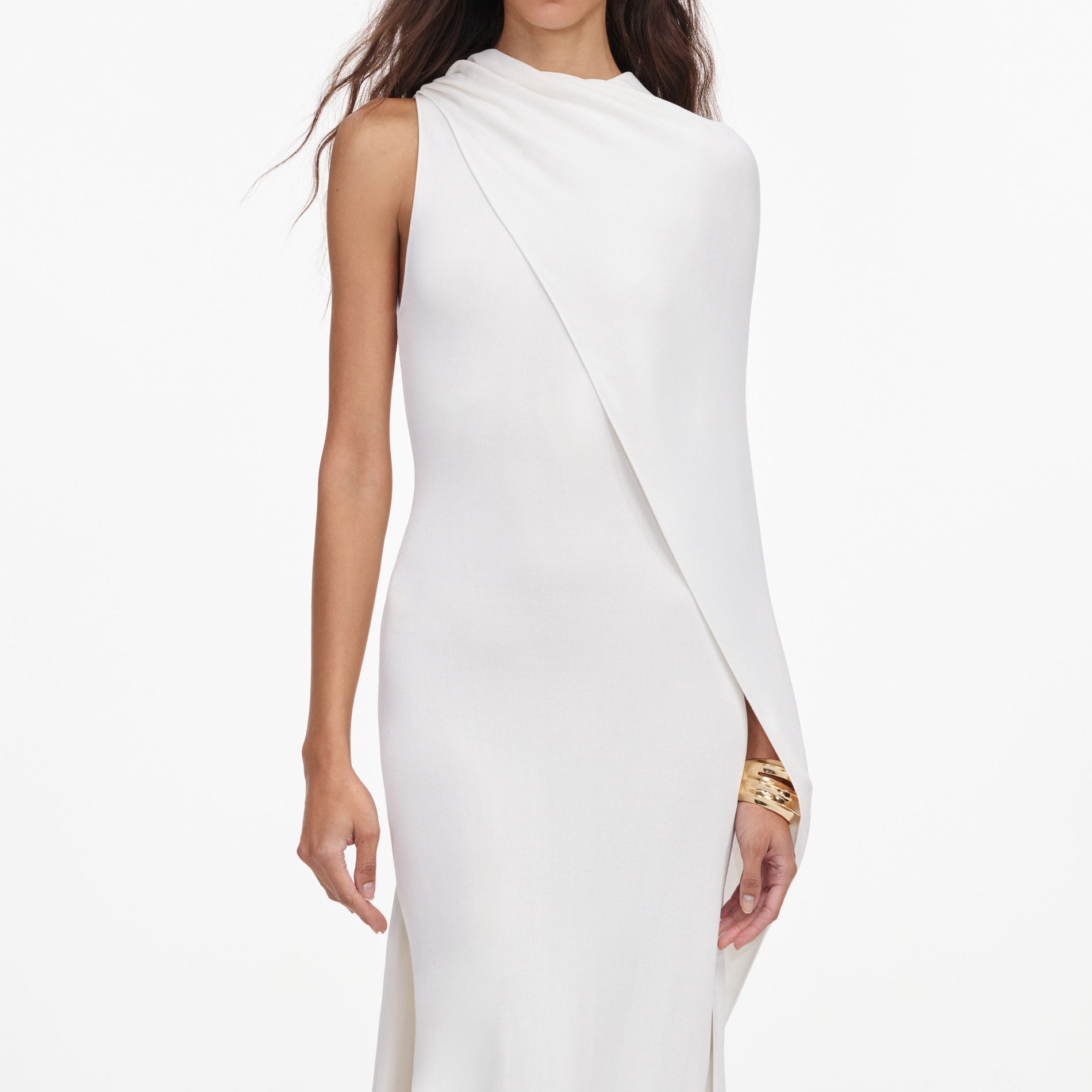 A close up of a woman wearing the White Viscose Knit Drape Maxi Dress