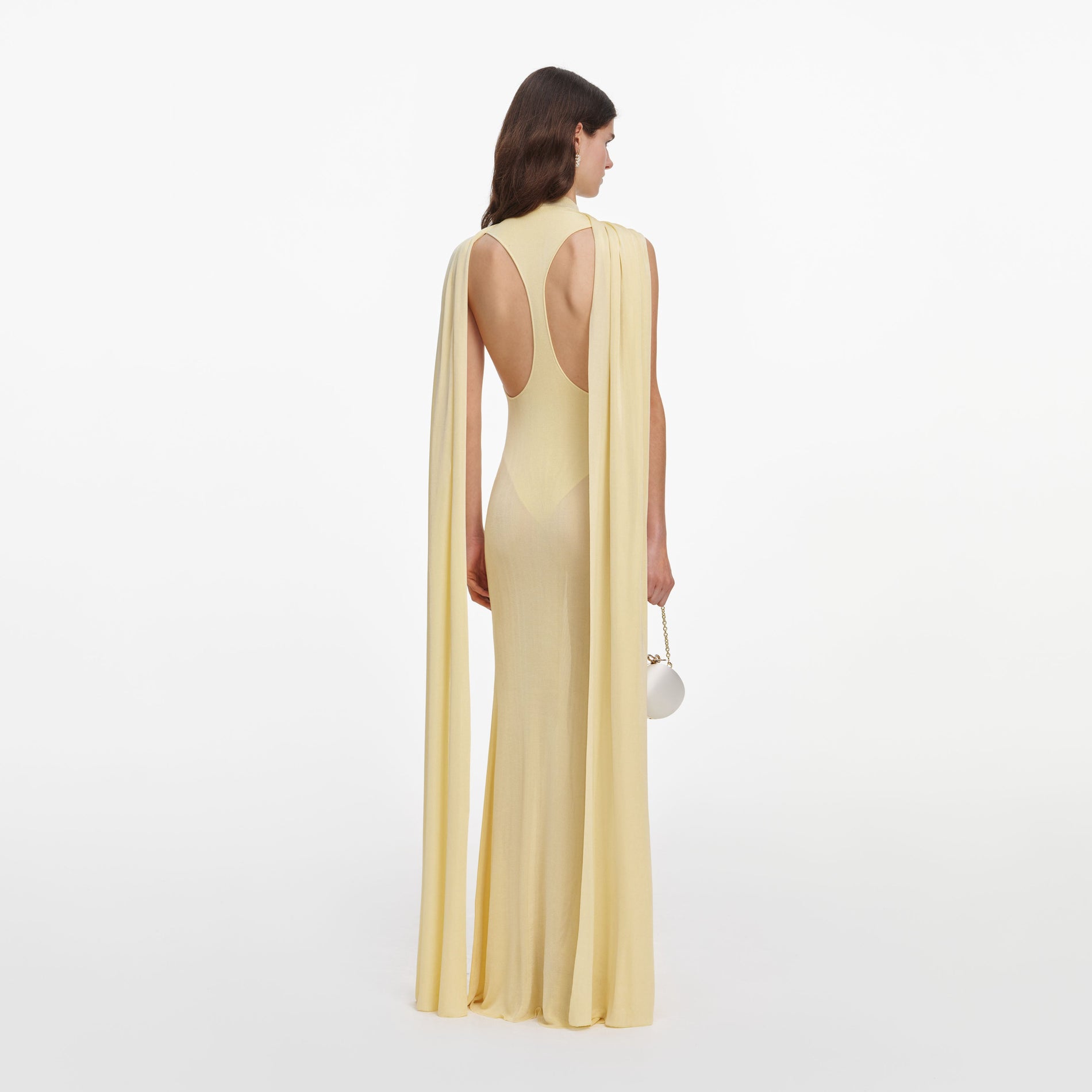 Back view of a woman wearing the Yellow Viscose Knit Scarf Maxi Dress