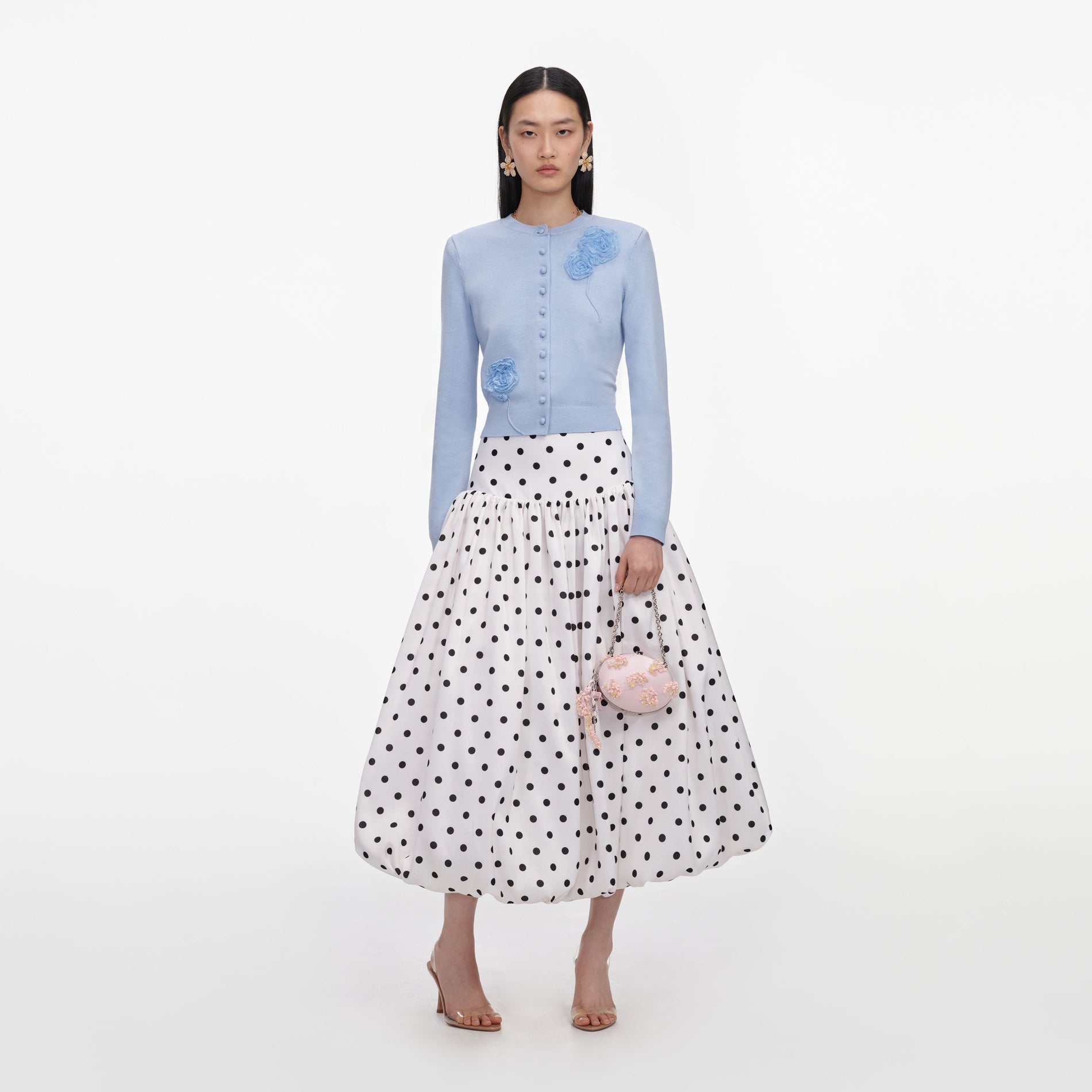 Front view of a woman wearing the Blue Flower Knit Cardigan