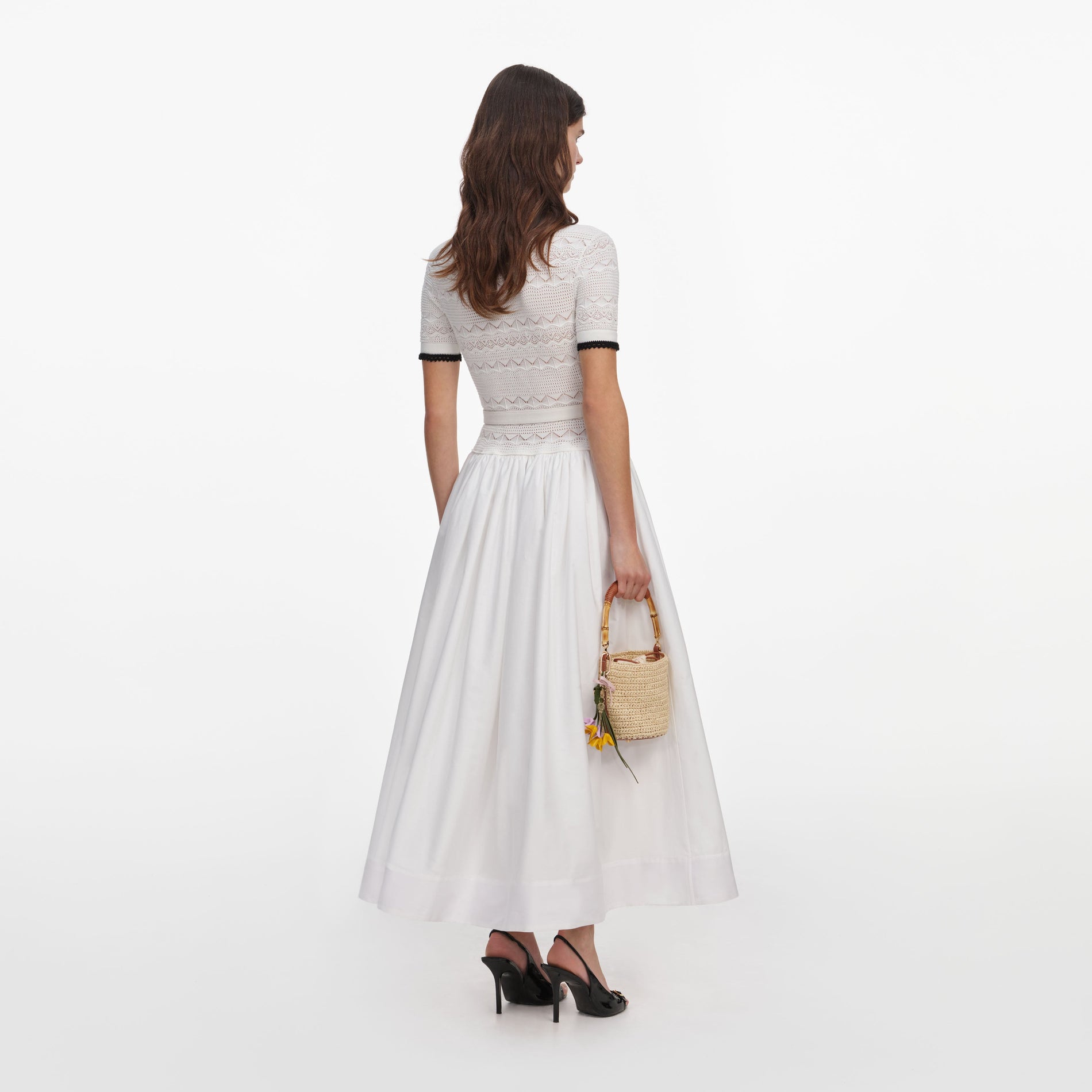 Back view of a woman wearing the White Knit Linen Midi Dress