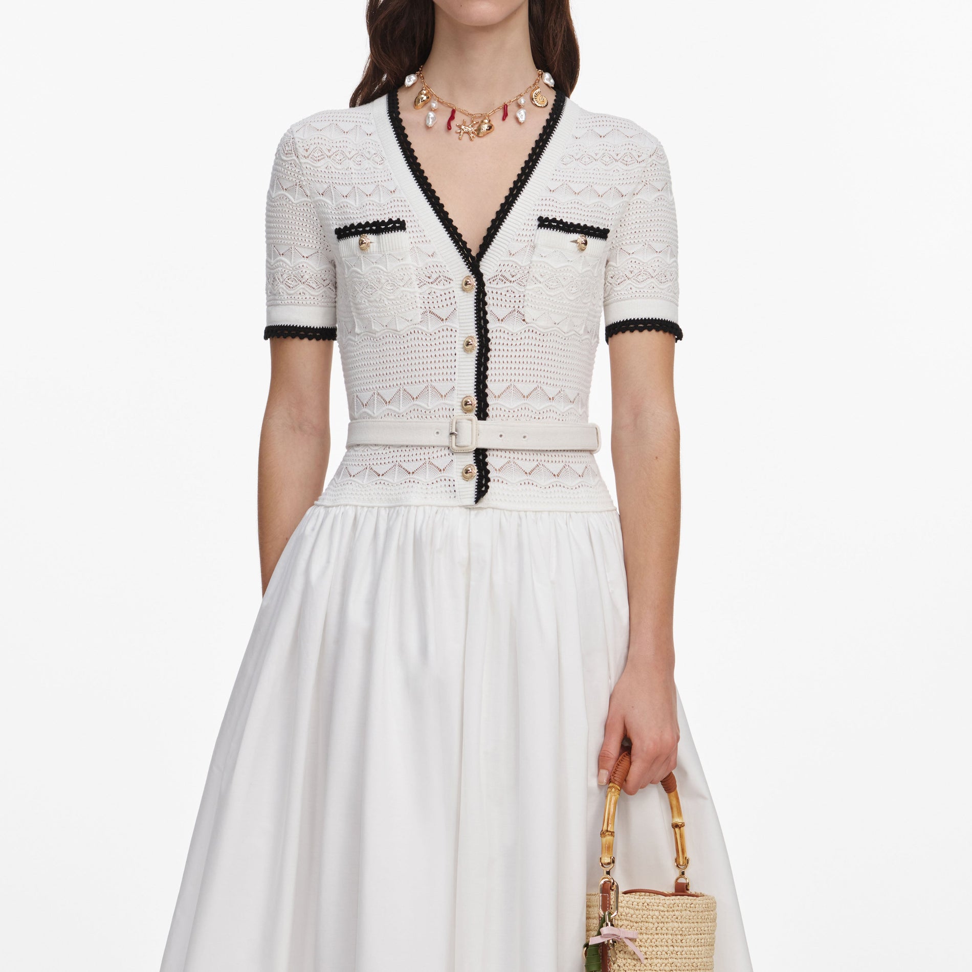 A close up of a woman wearing the White Knit Linen Midi Dress