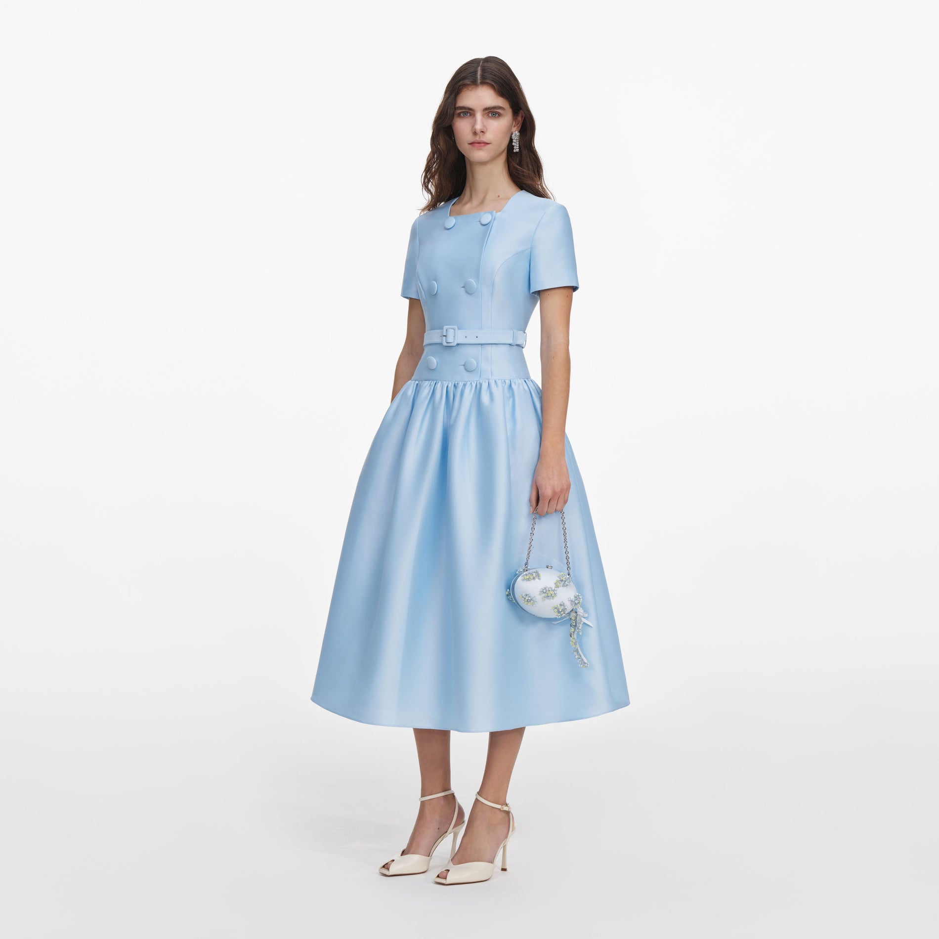 Side view of a woman wearing the Blue Button Front Taffeta Midi Dress