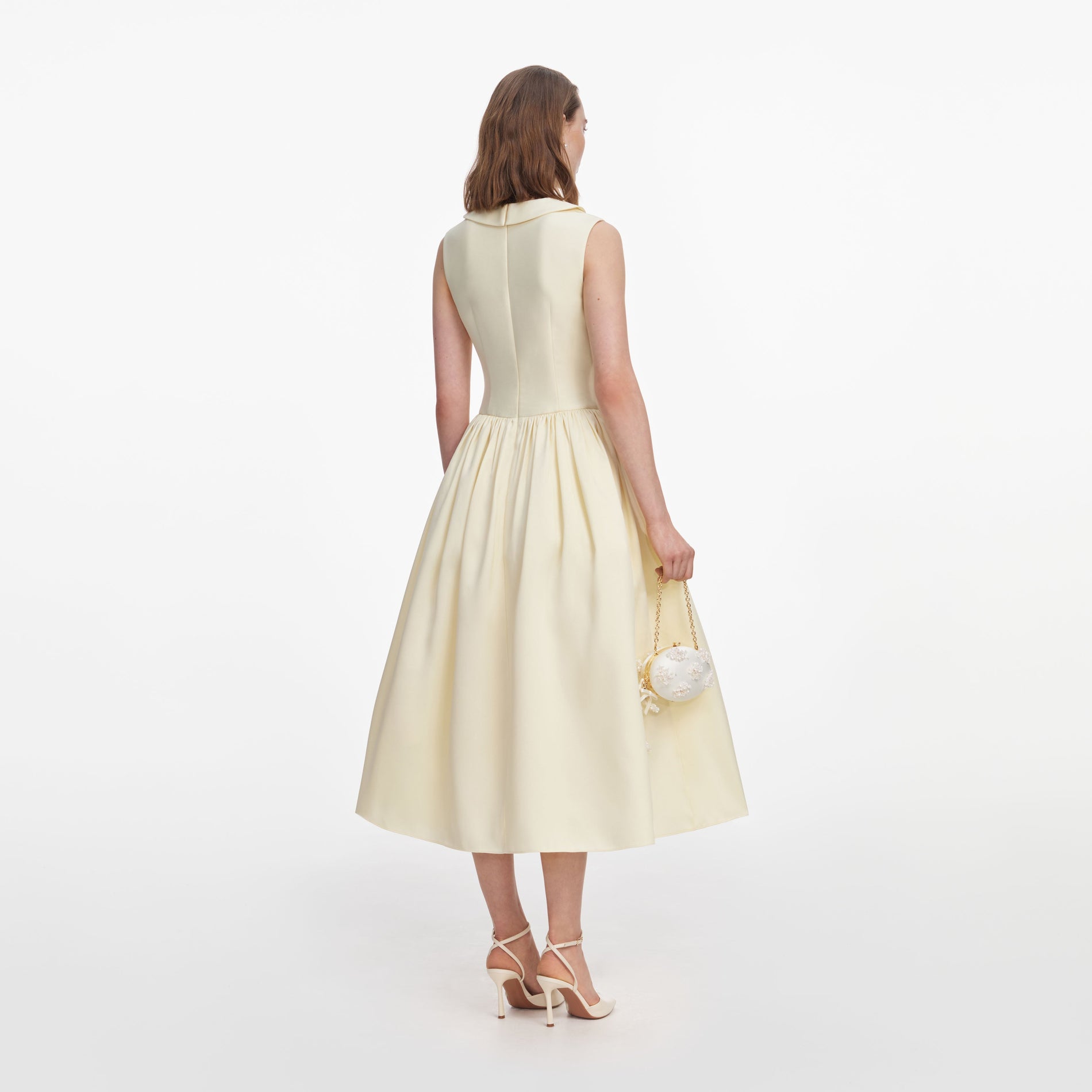 Back view of a woman wearing the Yellow Taffeta Collared Midi Dress